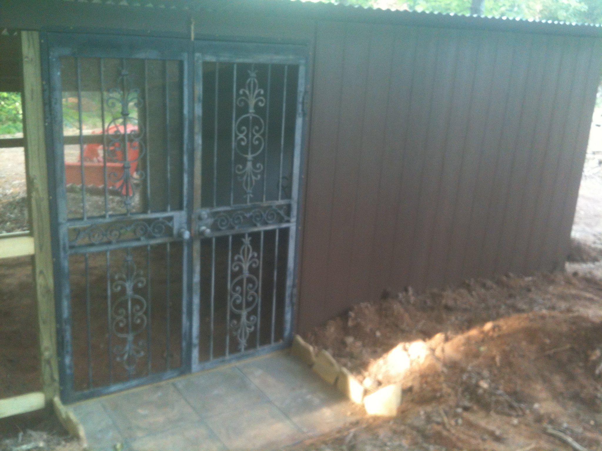 The iron doors are off a house flip I did several years ago, I screened the inside of the doors using large washers and sheet metal screws.