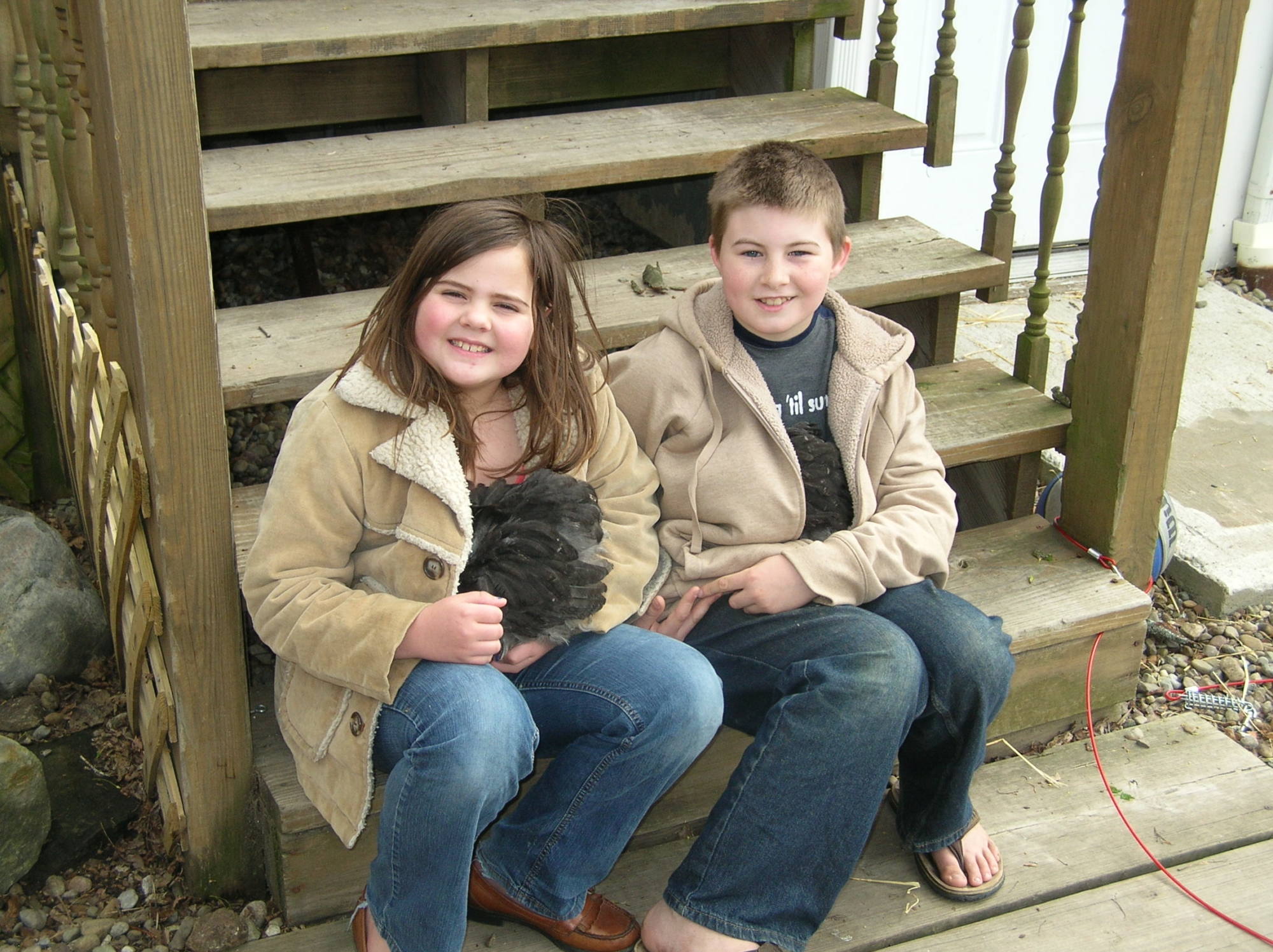 The kids holding the babies, Pom-Pom and Waffles.  They snuggle in their jackets and go right to sleep!