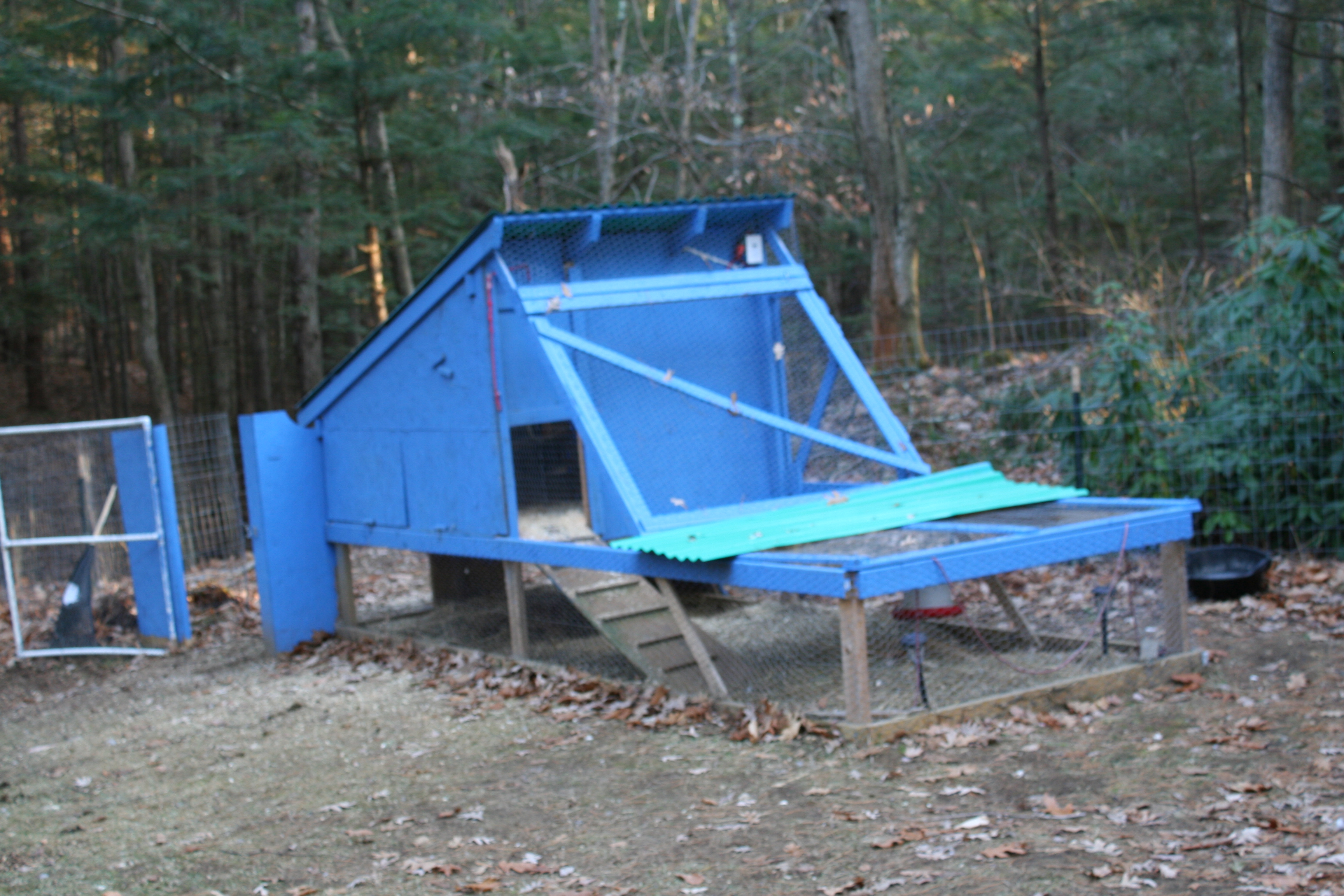 The layer coop.  I was originally going to be a tractor but weighs too much to move.The coop part is 4' x 8' and meant for 8 birds.  The run, which is kept covered in winter, is 4' x 16'.  There's also an attached pasture that's about 400 square feet, if we ever shut the gate and kept them in it.