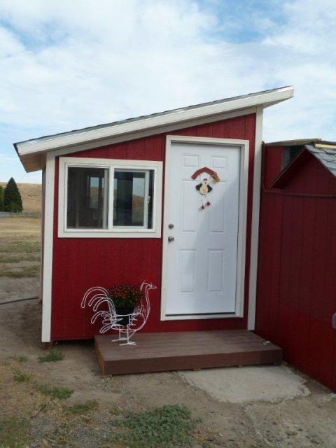 The Little Red Hen House - inviting, isn't it?  It even has a chicken flower pot that graces the front porch.