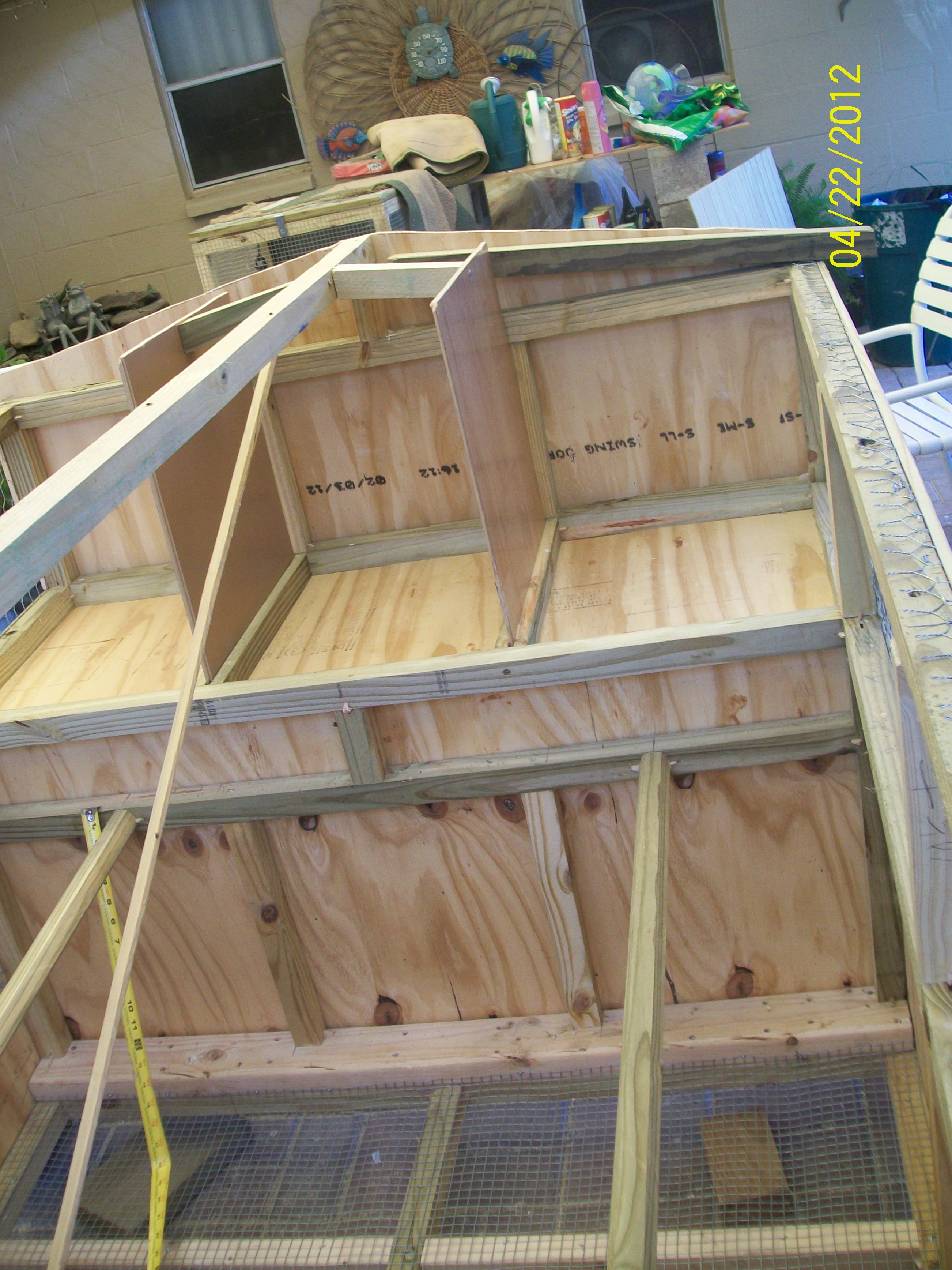 The Makings of the inside of a  Chicken Tractor ... 3 of the laying nest and Roosting logs..