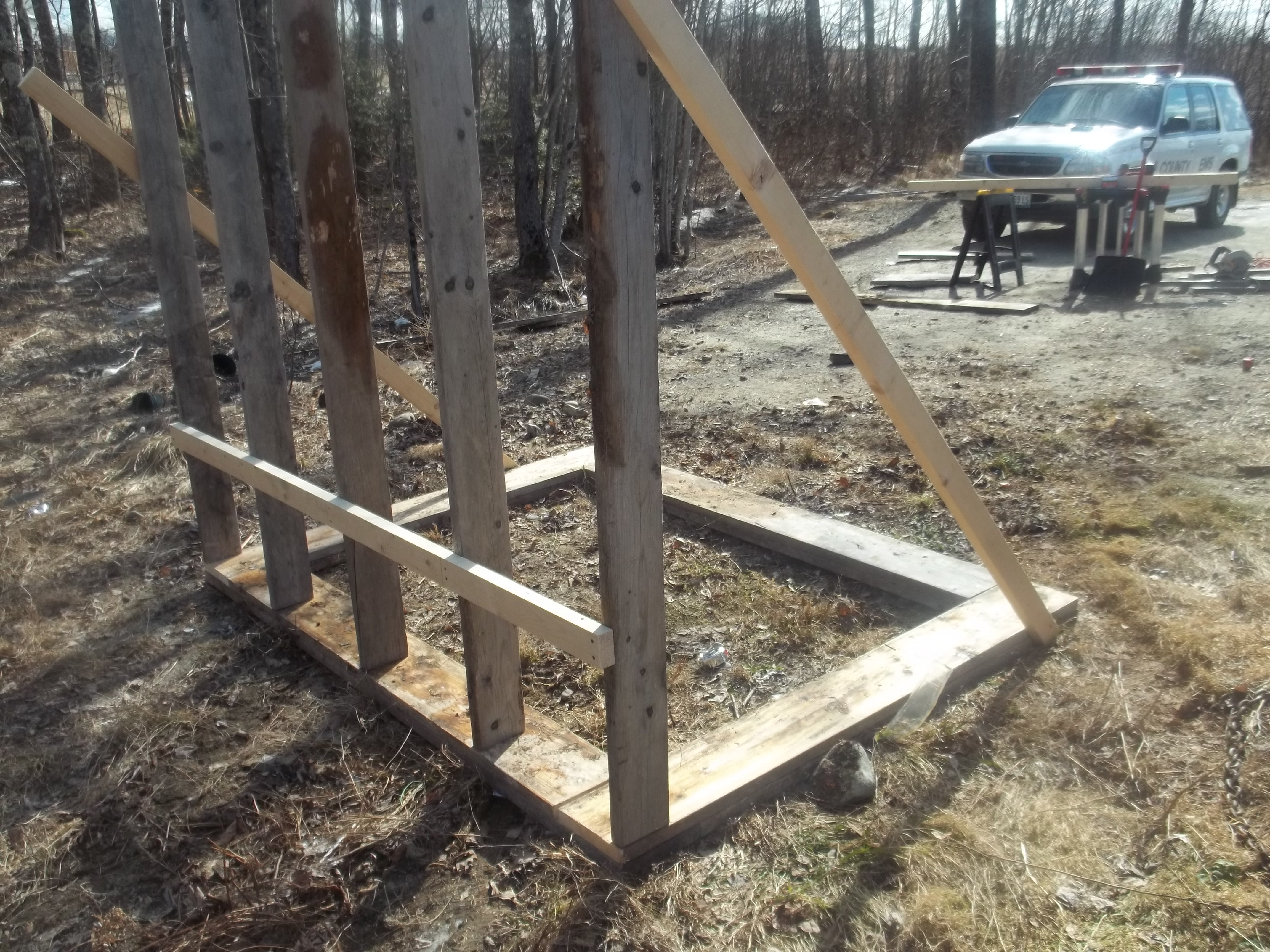 The Marriage wall.  I put the nailer up on the back side to support the floor of the coop when I get to that phase.  The 2X6's are recycled from a boat cover project last year.  You cannot see the top plate on the wall, the angled studs are just to keep it square