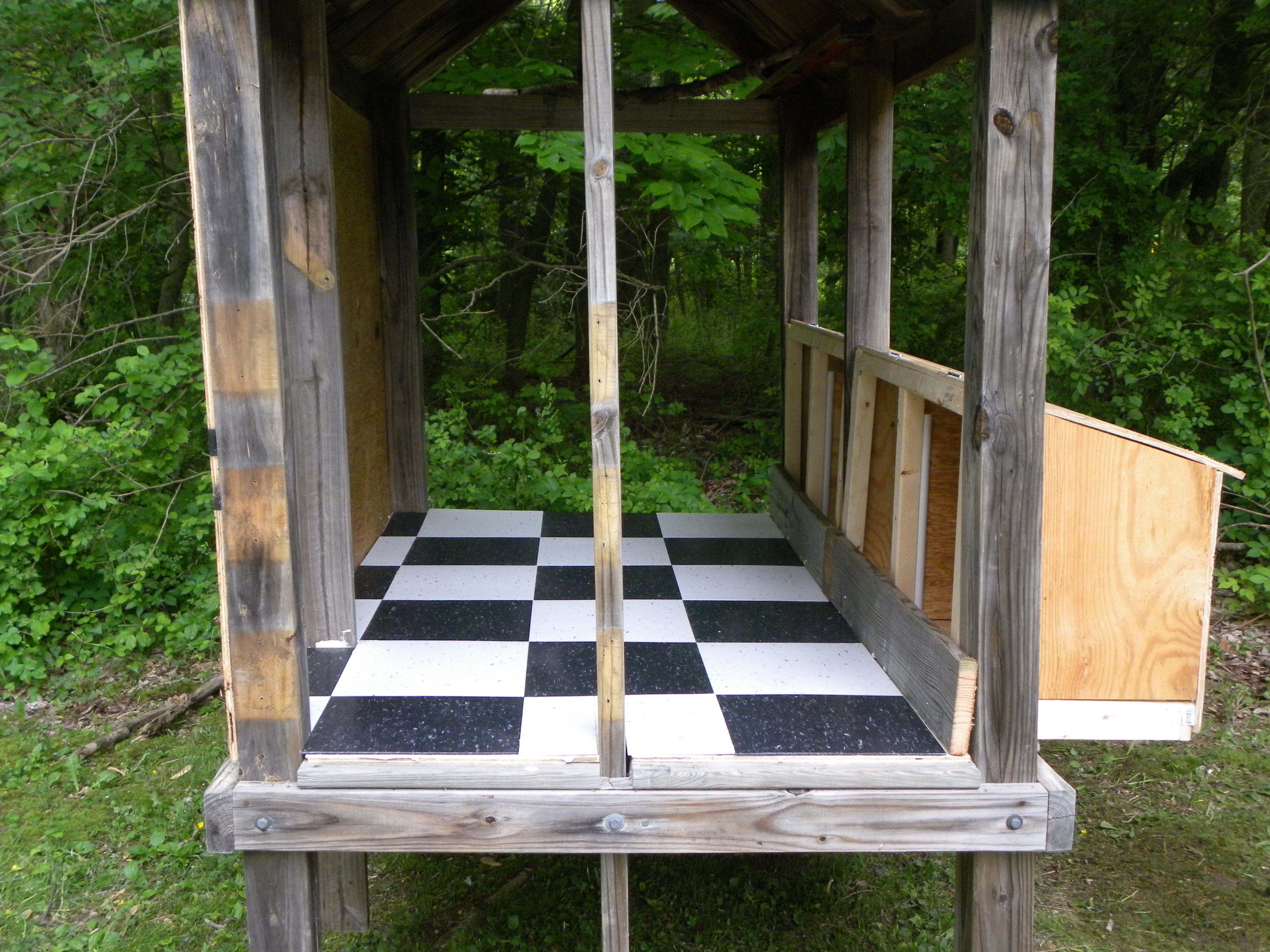 The tile was left over from when I floored the motorcycle trailer and much to hubby's chagrin I refused to build a coop without a tiled floor!