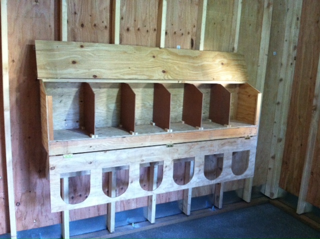 The top opens and the front folds down.  The dividers are removable to make cleaning and refreshing the bedding easier.