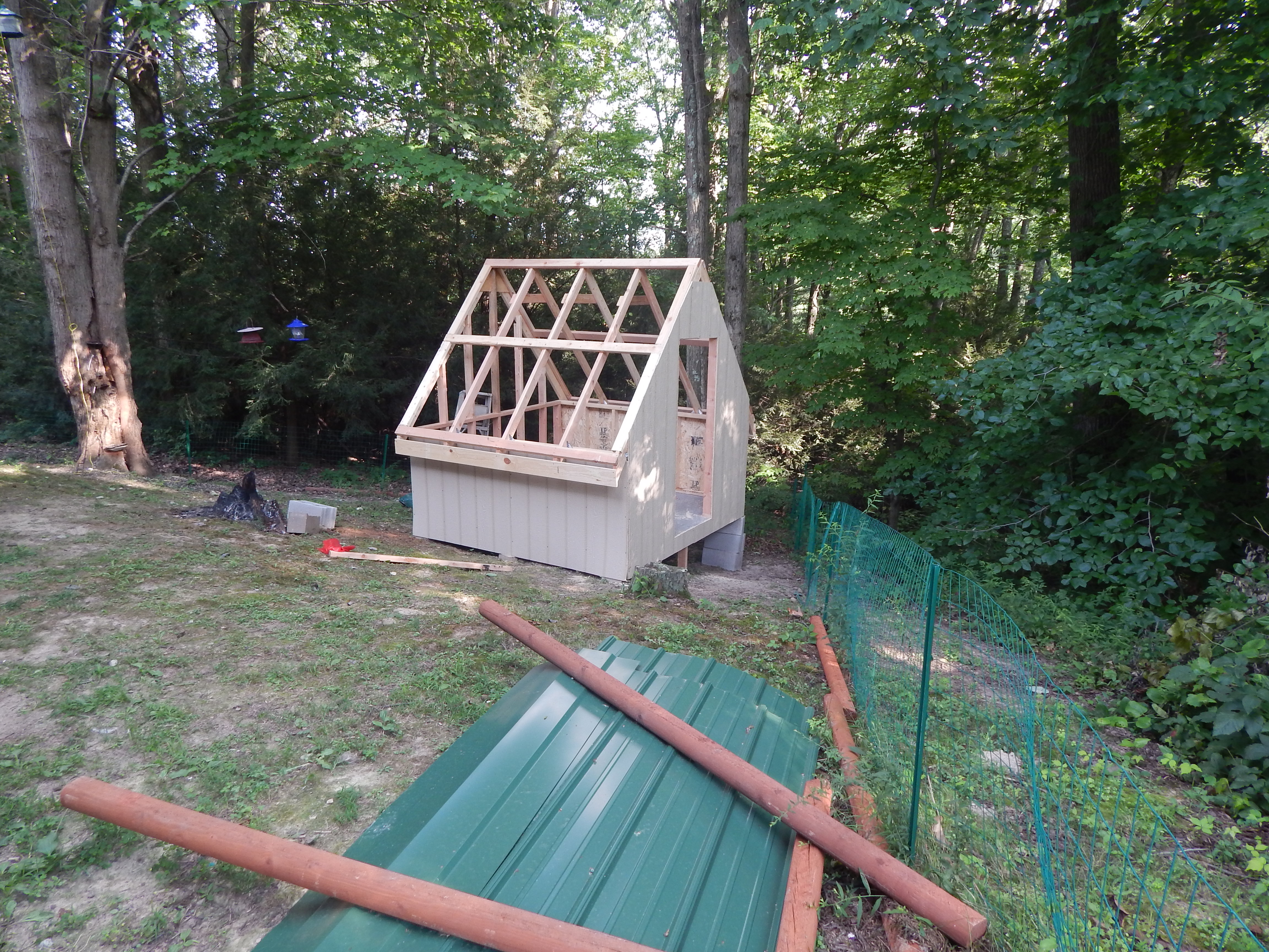 there is the roofing material, had I known when I bought it you would have to order the trim pieces  that match special order, I would not have gone with green! Oh well nothing a can of green spray paint won't take care of so I got white ones!