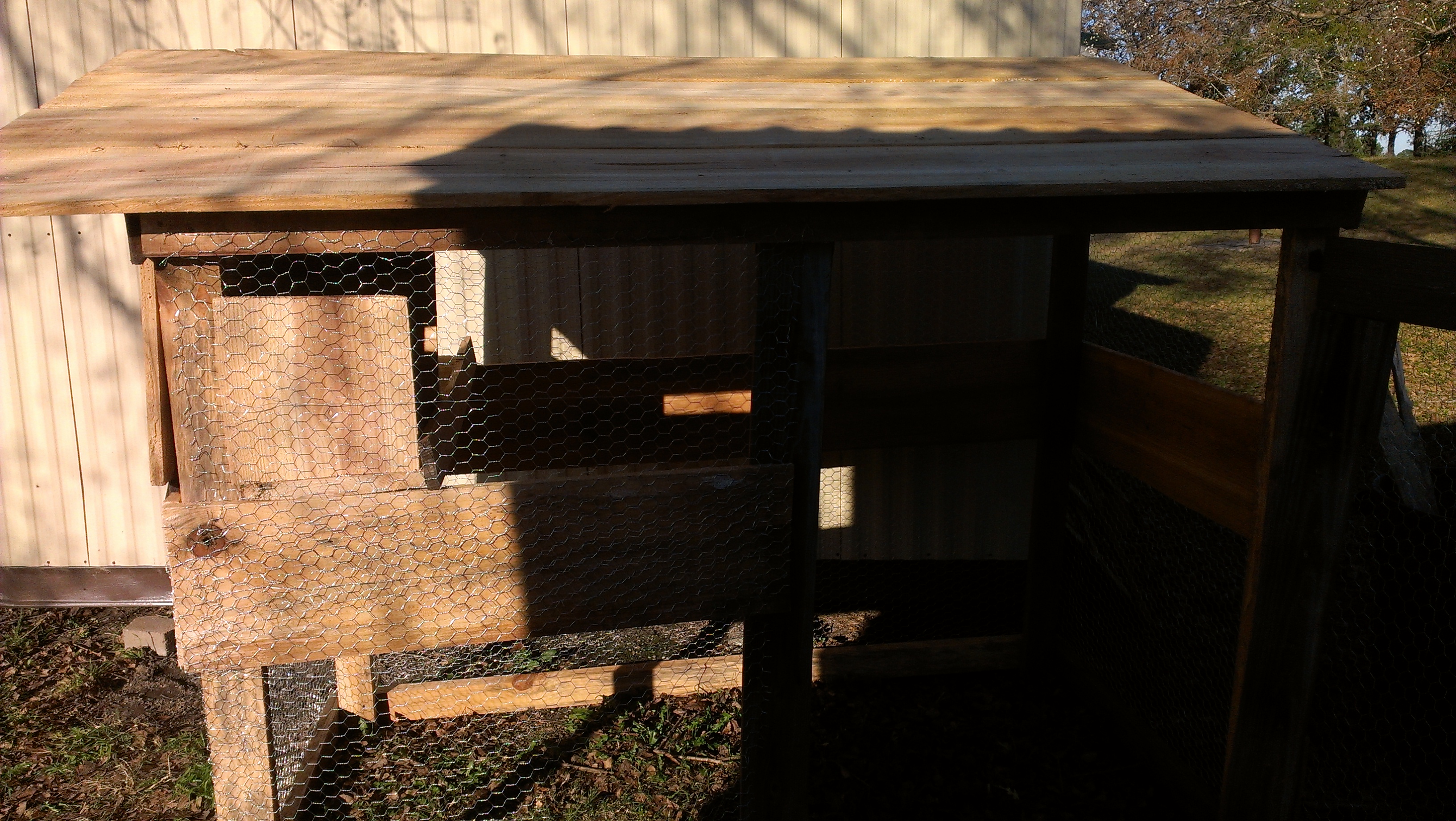This coop is mostly reclaimed lumber; some rough-cut directly from my landlord's small pine mill. 8'x4' base, 6'-5' roofline. The hinges and latches for the cleaning door and main door are made of belt leather. Used ~128 sqft chicken wire. Nesting box separate from roosting area.