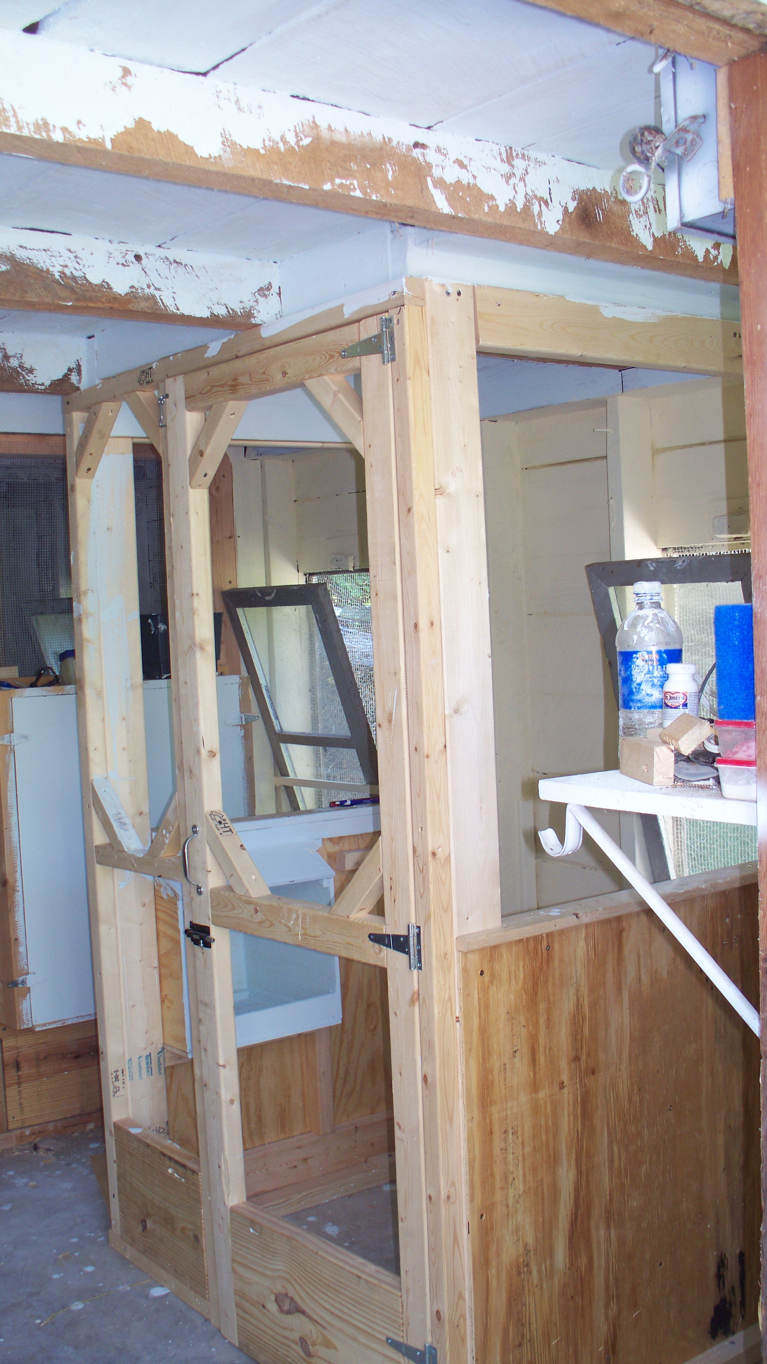 This is a 3 x3 space for sick bay. It's still there. I leave the door open and have only used for injured hens. 
Also, the inside of the coop got a limewash paint to help keep bugs, mite and lice at bay. It has helped but is need of a good recoating.