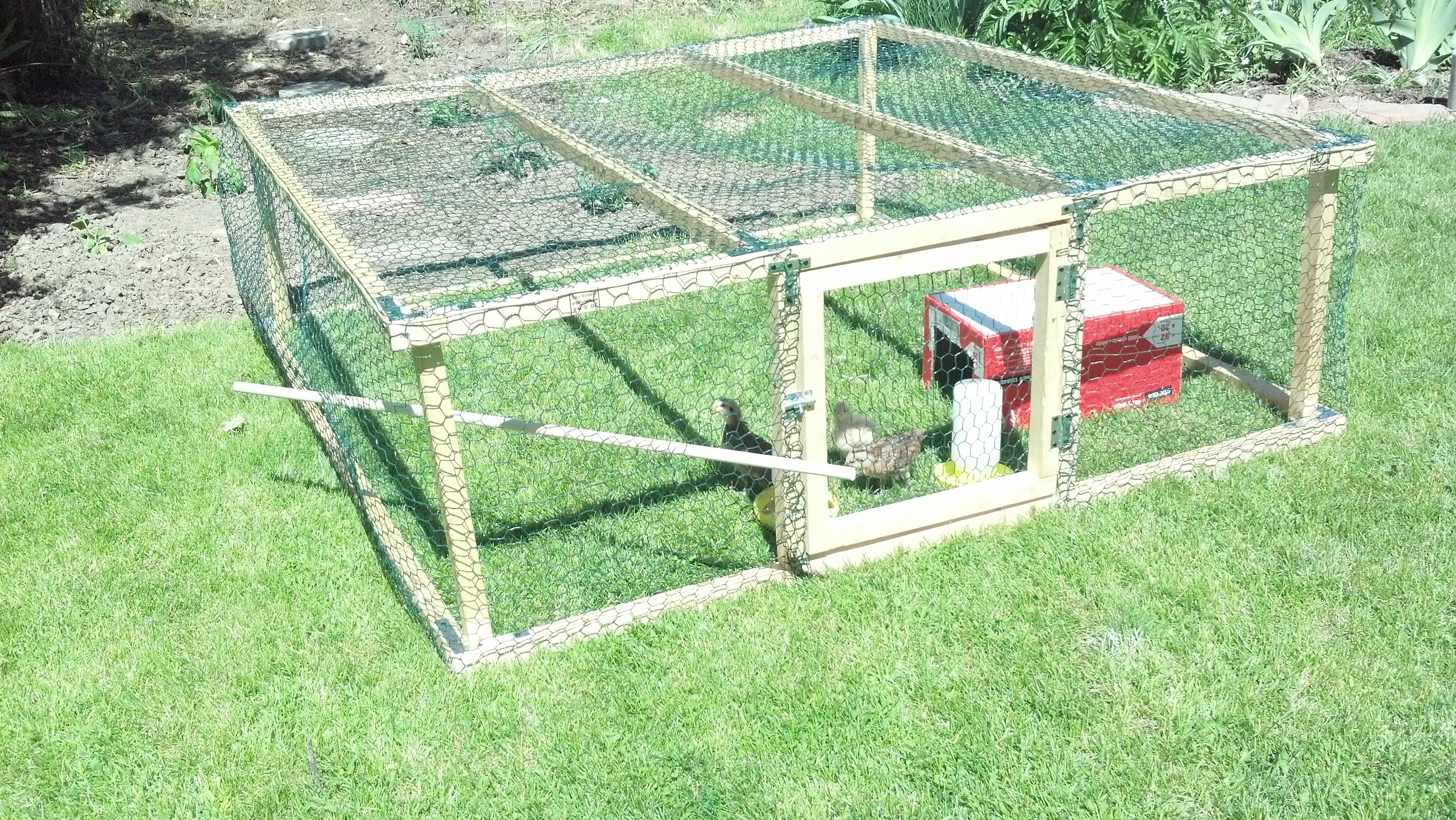This is a 6' x 6' x 2' chicken run constructed of 2"x2" boards and chicken wire.  It is equipped with a removable door.