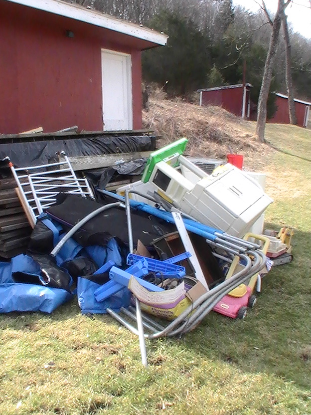 This is all the stuff I had to move out of my coop, it hasn't been used since I was a kid but it was a functional chicken coop in its day