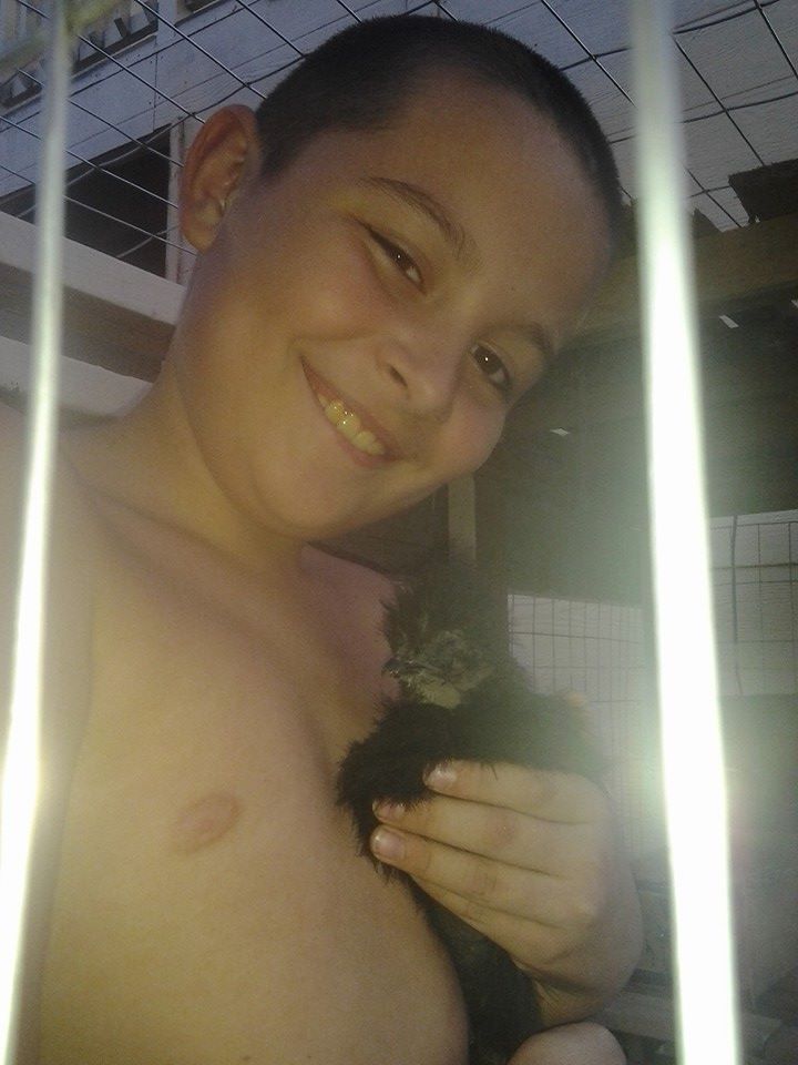 This is my youngest son Liam with our silkie Cotton*