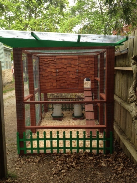 This is our coop as viewed from the west.  Human access and hen access doors.  Feeder and waterer are under the henhouse.