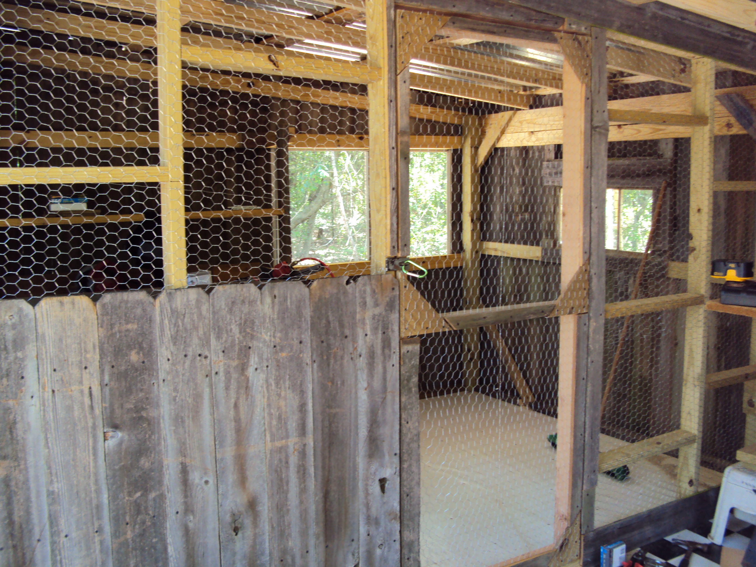 This is the chicken wire wall that divides the chickens half from the feed room.  There is also linoleum on floor of their side.