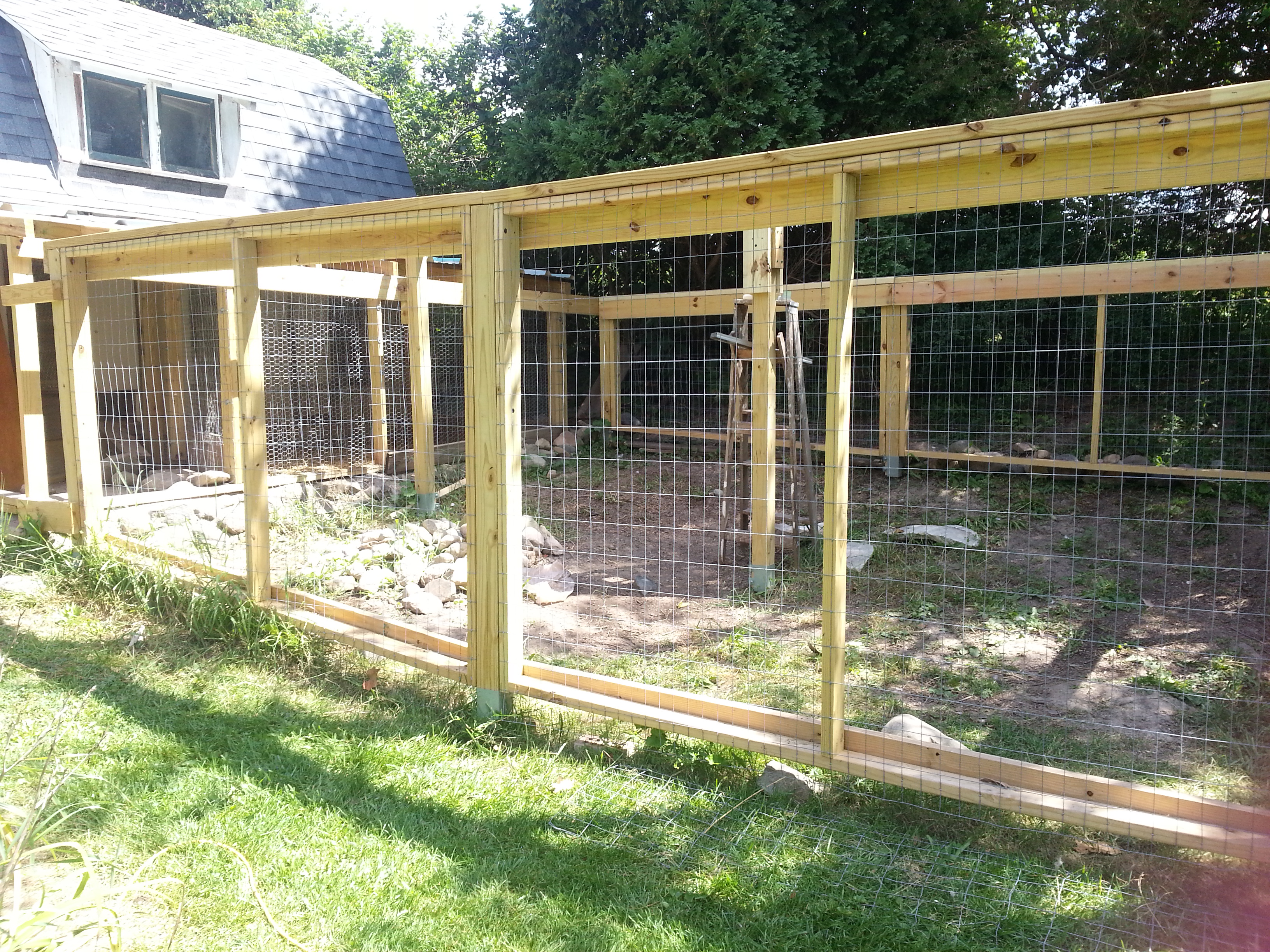 This is the extended 13 1/2 ft  x 16 ft with a 1 1/2 foot connection space.  The posts are set in place using metal post stakes.All of the frame is made with removeable panels to make any future modifications or removal easier. The whole run is made completley with screws and lag screws all predrilled.