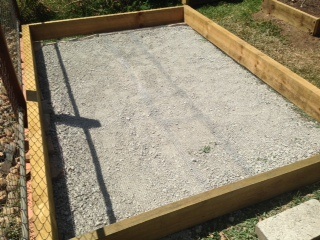 This is the final product of a mornings work,no holes,cracks and no open holes that rodents can get in and eat the food,foxes can't dig under the walls to the chickens.Looking pretty good!