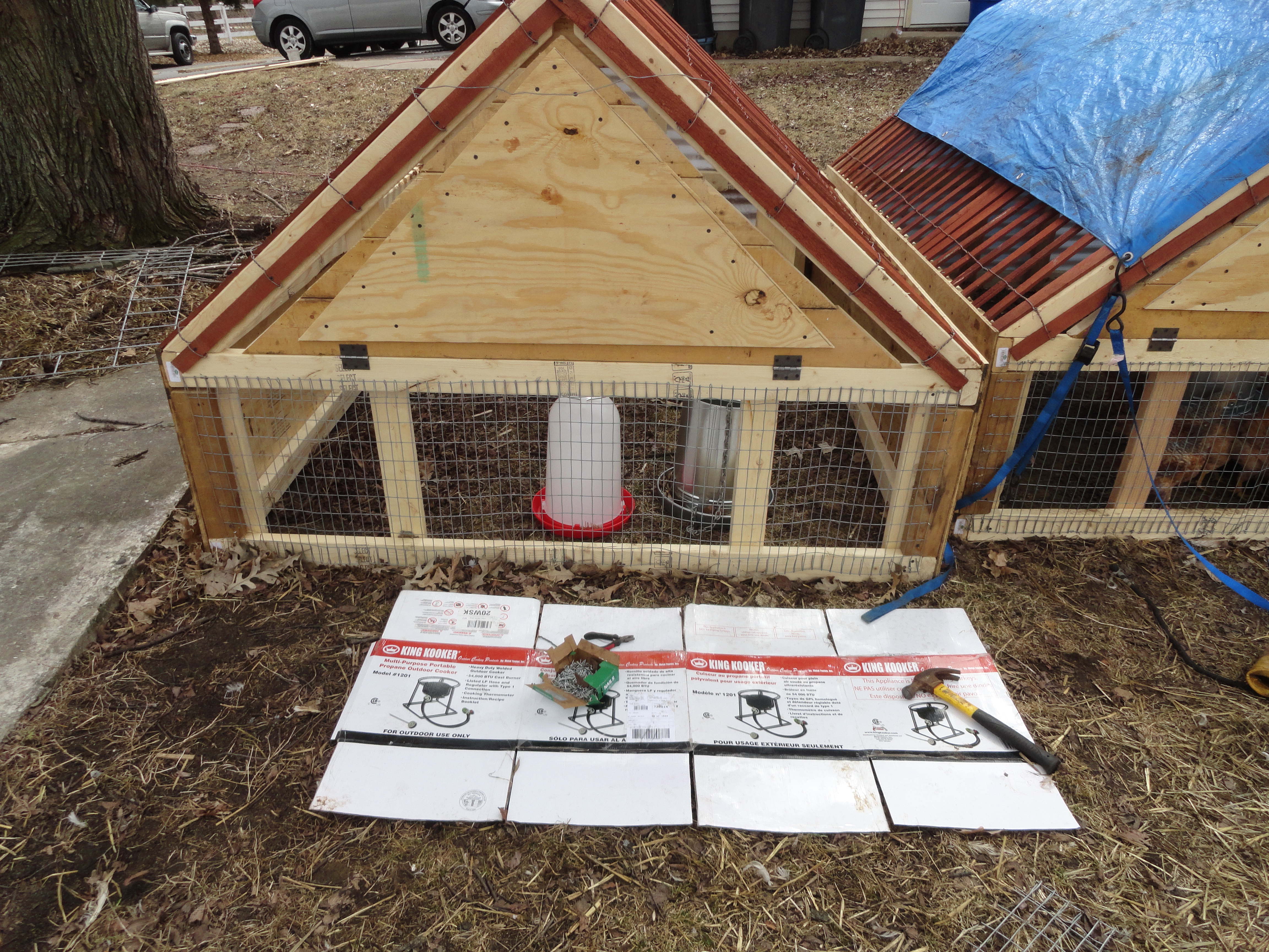 This is the front view of my mostly finished chicken tractor.  The upper triangle is the fold down door.  In the winter they will go into my barn and with some tarps and straw bales they can be used either as a breeding pen or to raise my chicks in after they are out of the brooder.
