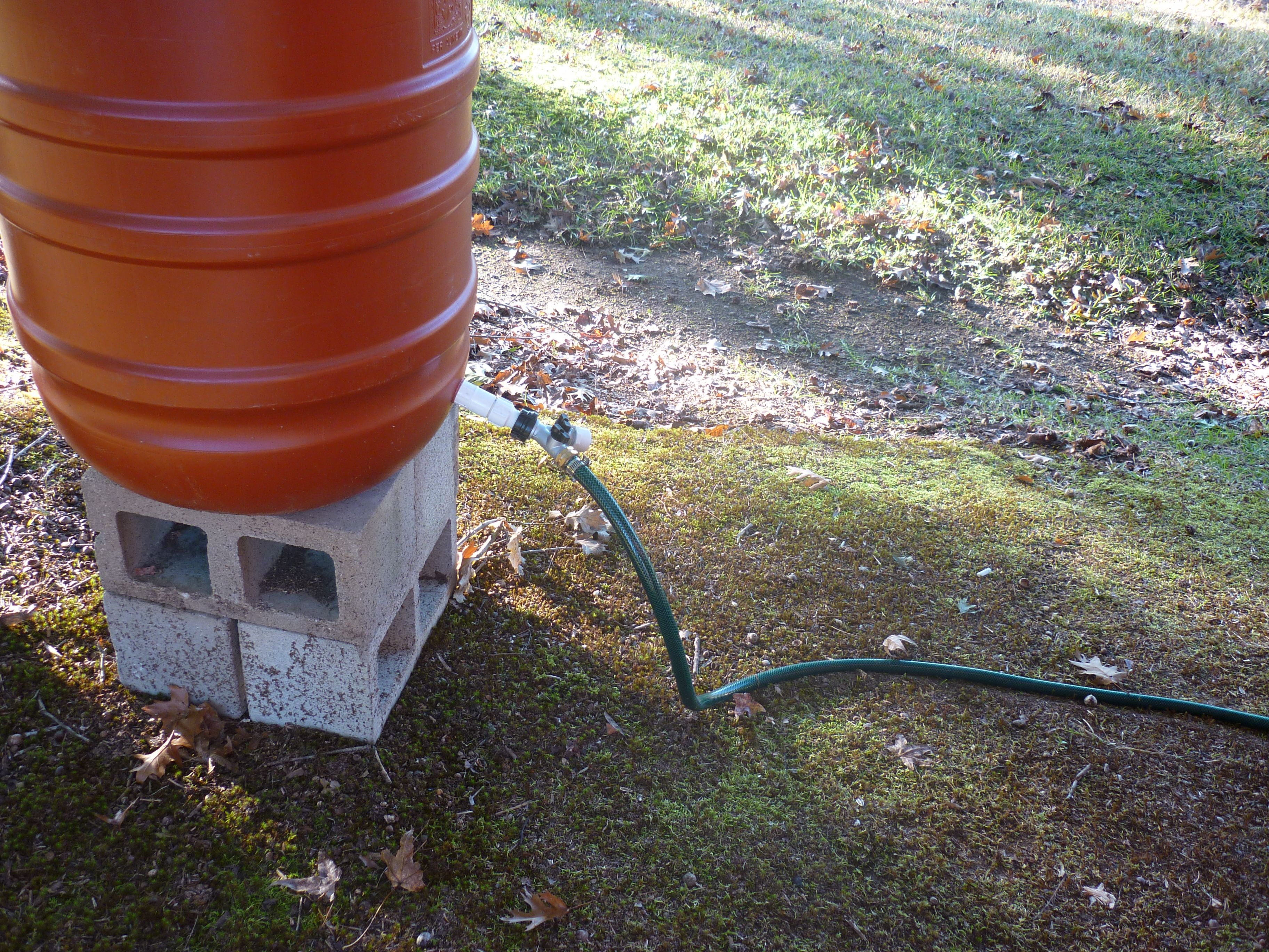 This is the water barrel.  Notice that it has a dual water spicket.  One has a hose attached that goes into the coop, the other will have a hose attached that goes into the run.  These feed water through PVC pipes in both the coop and the run providing water to the chickens via nipples.