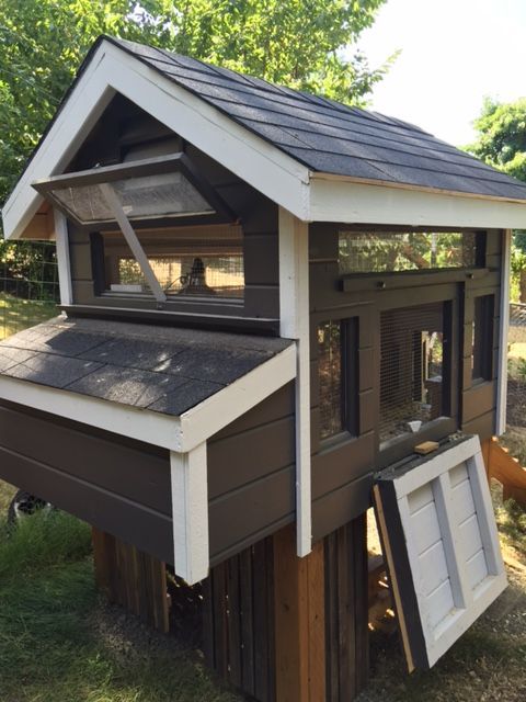 This picture shows the upgrade screen door at human door.  Screen door hooks tight up to rafters inside when not in use.
