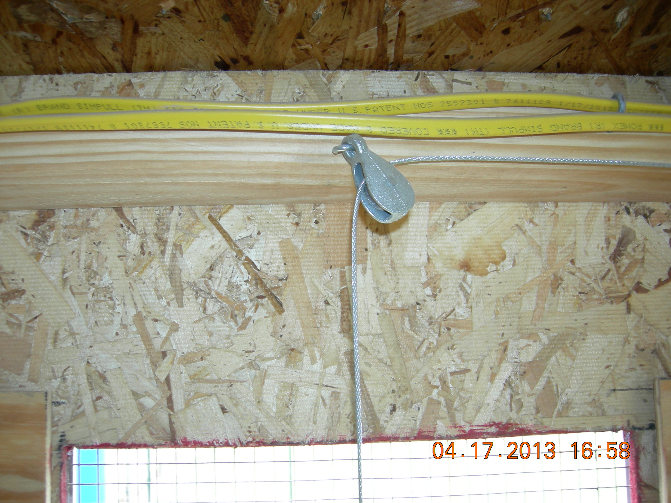 This pulley is above the pop door.