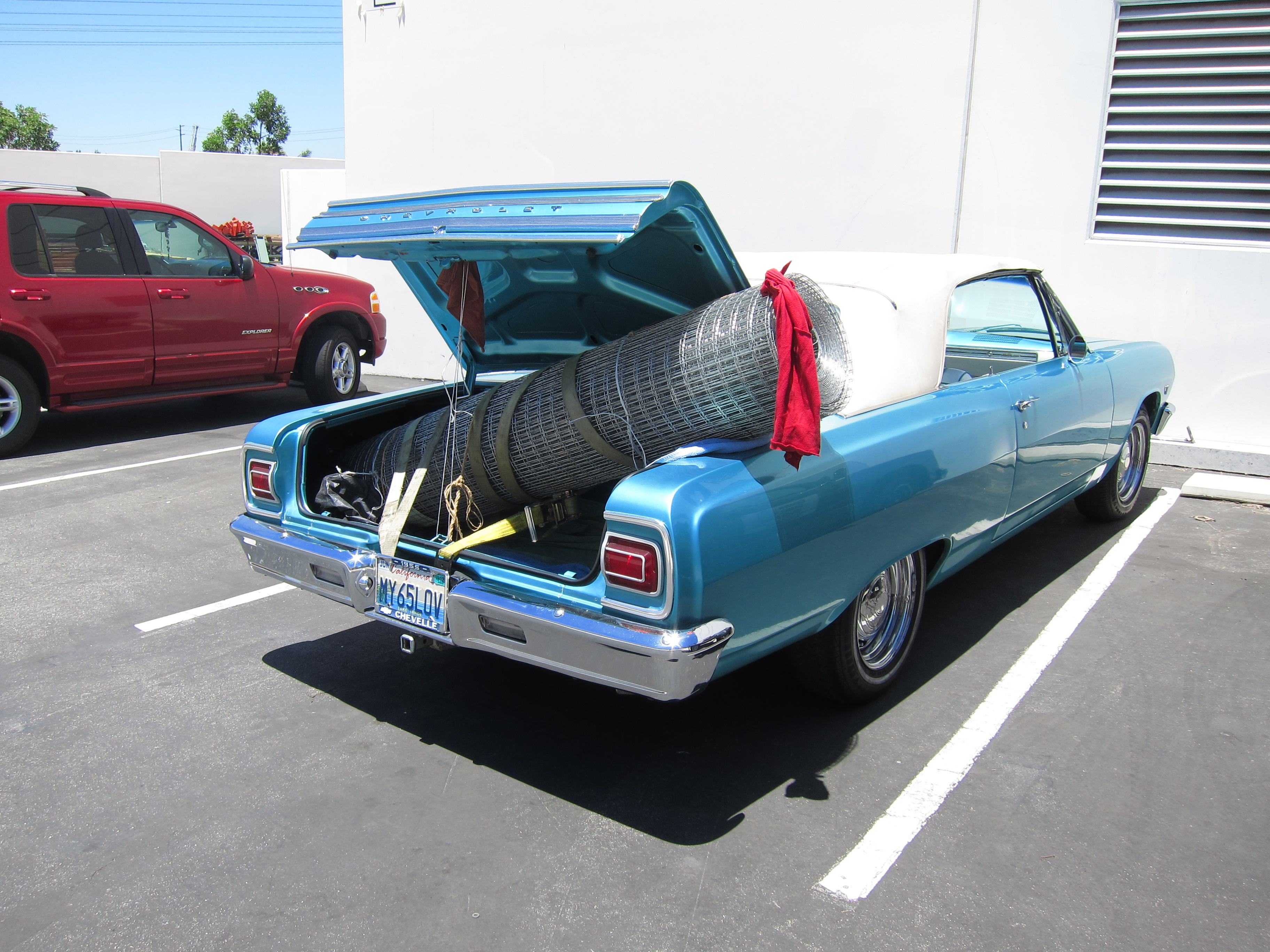 This roll weighs 200 pounds!  It took 3 big guys an hour to get this roll secured into my poor chevelle's trunk   They had to strap it in with ratchet straps, and loop it all through my cars frame beneath the license plate.   When I got home, it took 2 guys and a big dolly to get this thing in the yard.   I used only a fraction of the roll for my 8'x5' coop.  The rest sits beneath my avocado tree.