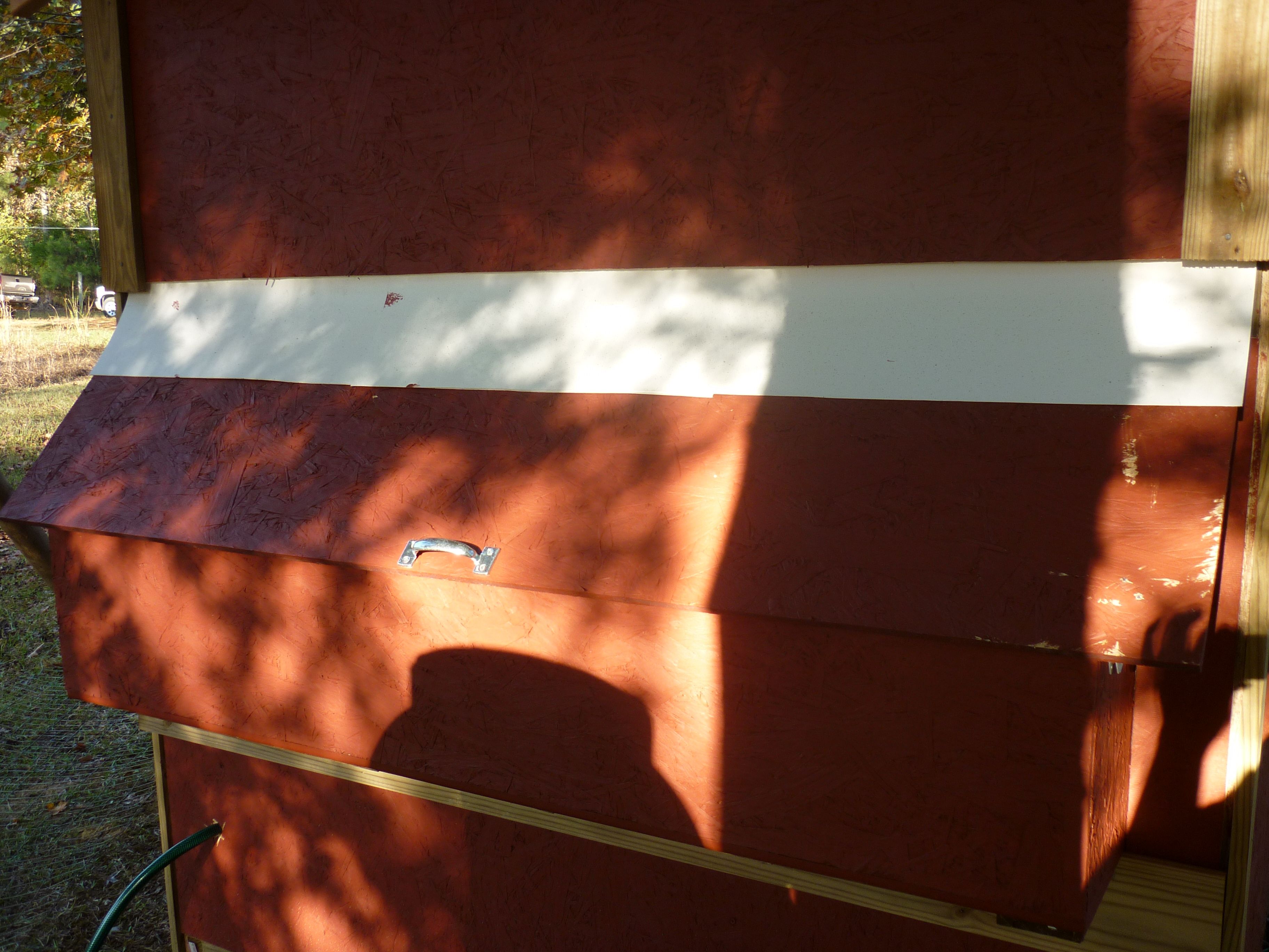 This view is of the back of the coop with the nesting box door closed.