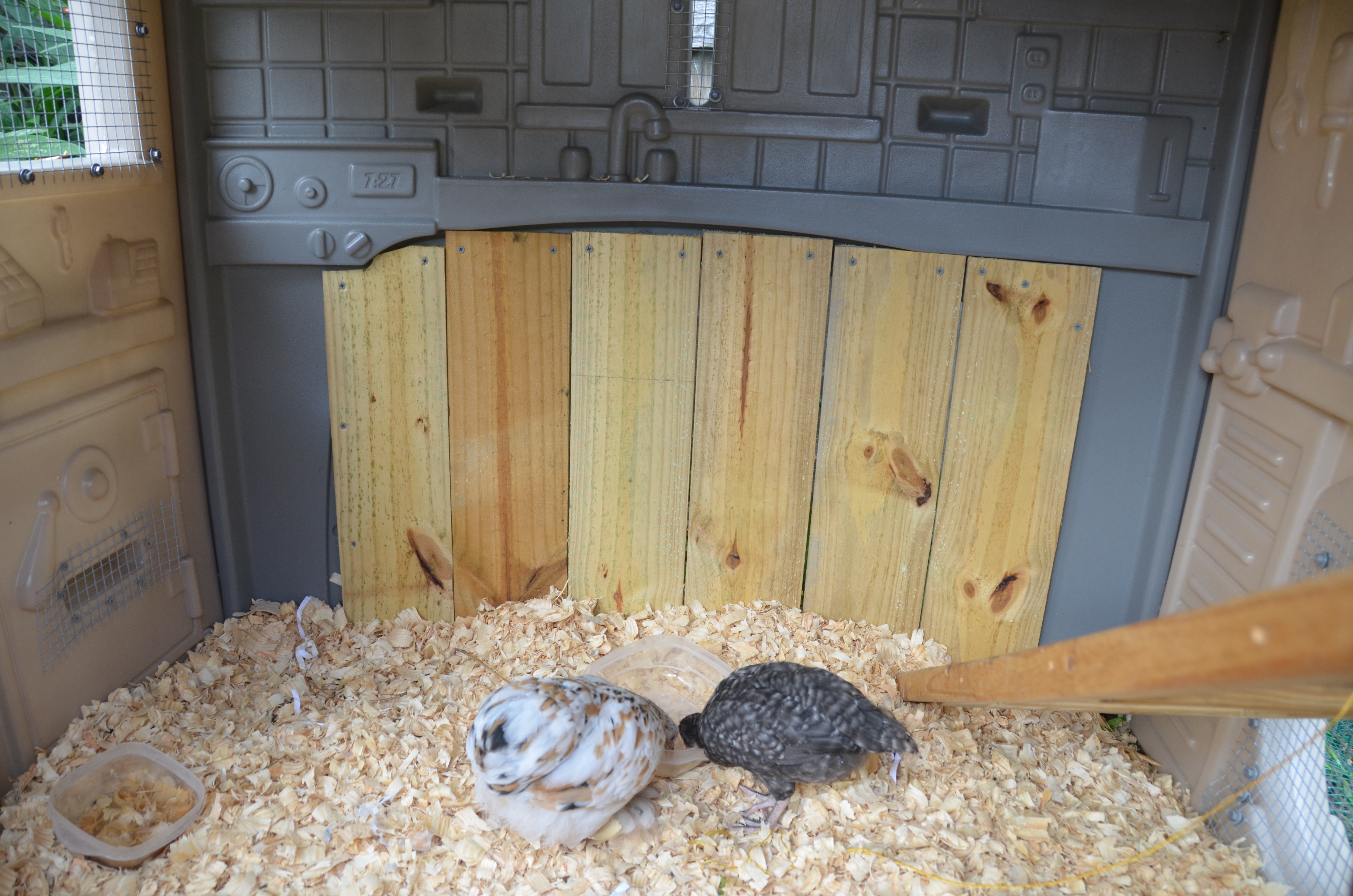This was a soccer goal.  We used fence panels and cut them down to fit.  This playhouse is curved on most sides so it poses some issues.  I plan to add their nesting box onto and a shelf as well.
