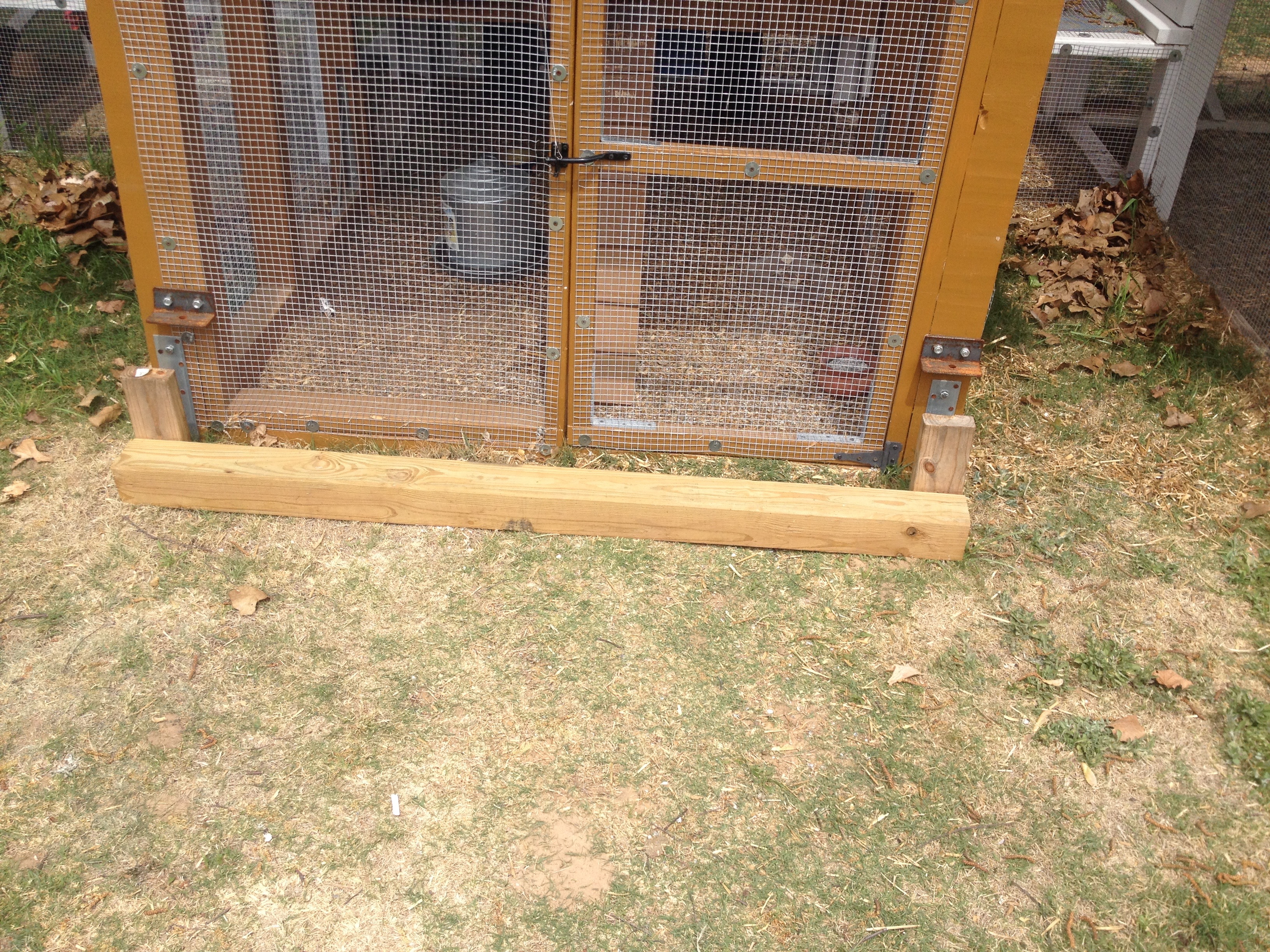 This wooden piece fits between the coop and the metal towing bar.  Using it, the wire screen on the coop doesn't get torn up when moved.