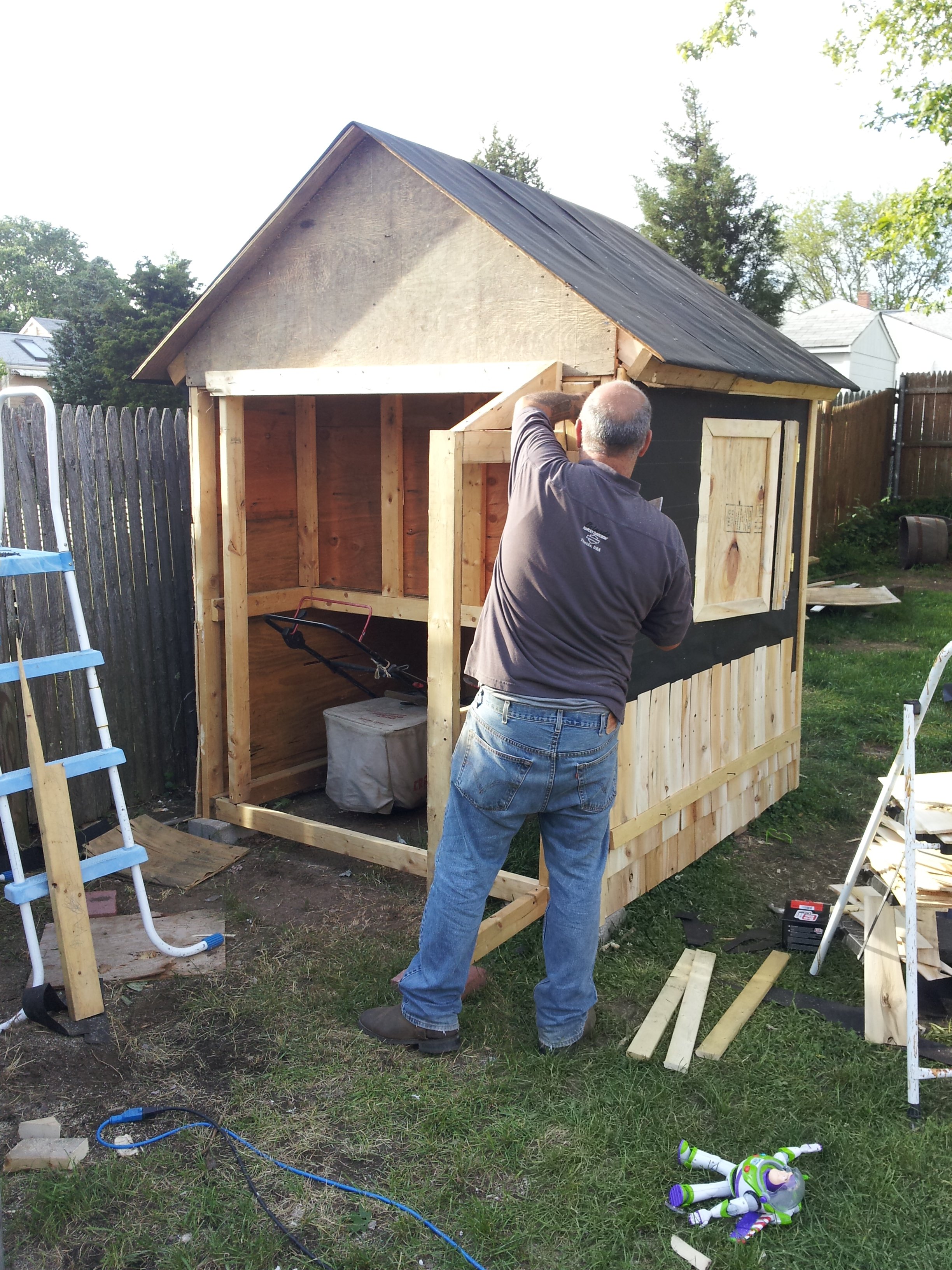 Tilt yourselves once more..to admire my hub bulding the bump out area.. which will have barn/panel access doors to the shed storage.  Notice lawnmower, wheelbarrow and yard seeder fit perfectly under the coop area.  A floor will be built shortly.