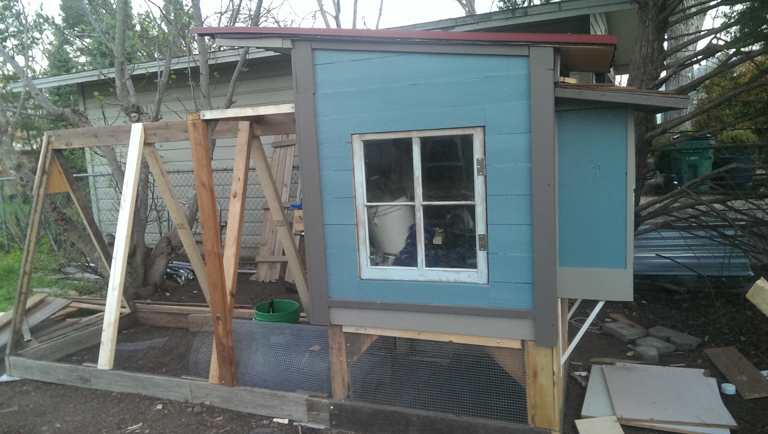 touched up the paint & started the hardware cloth underneath the chicken coop.