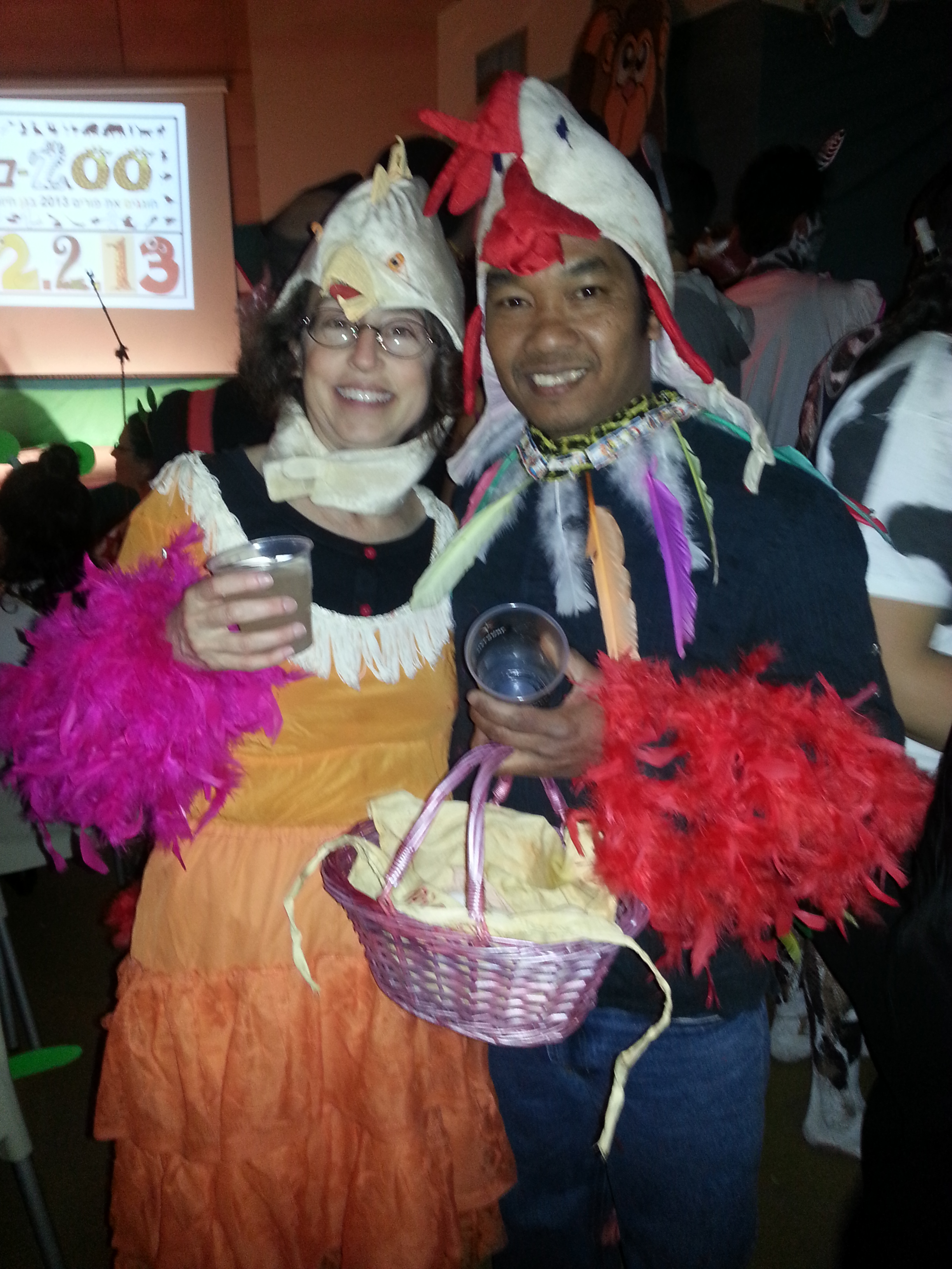us, as chickens... me being the laying hen with eggs in basket; hubby being the thai fighting cock...