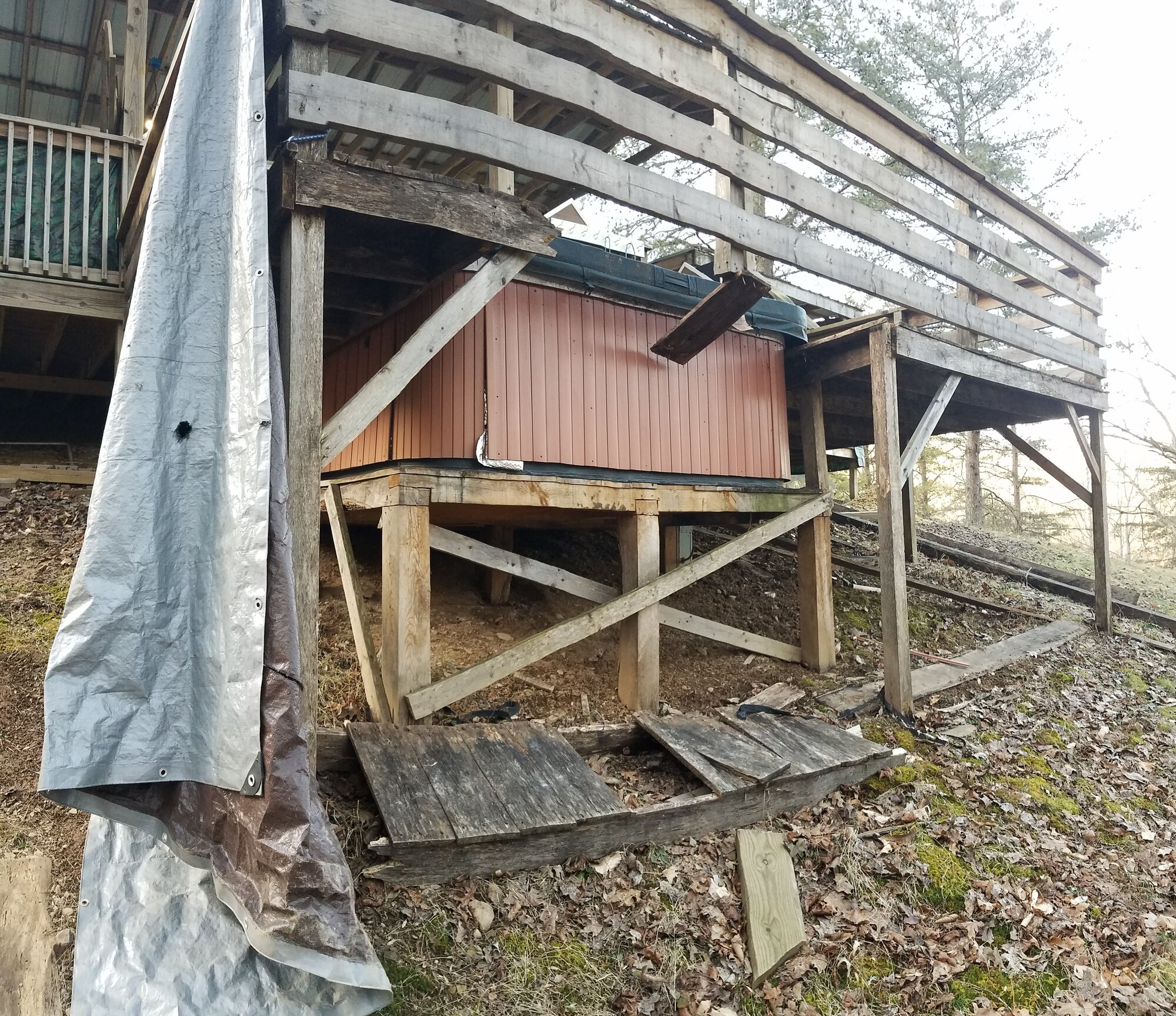 View from below, the hole in the floor and the floor-boards on the ground.