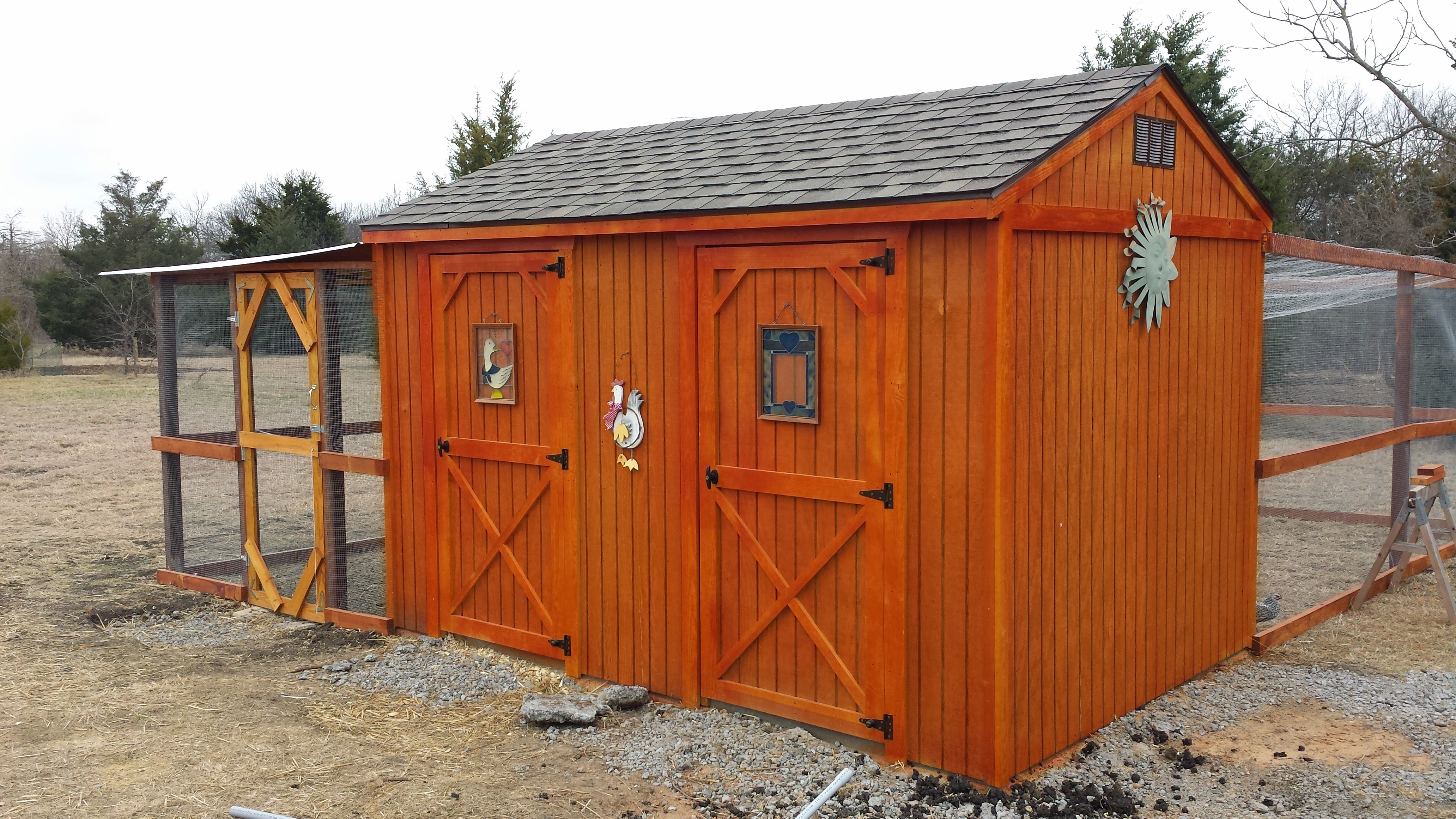 View from the front of this 8x12 shed.  Door on the left is the coop.There is a divider wall in the middle so the door on the right is storage for their snacks, feed, pine shavings, DE, pitch fork, dedicated chicken coop boots, etc.  Both sections have their own window too.