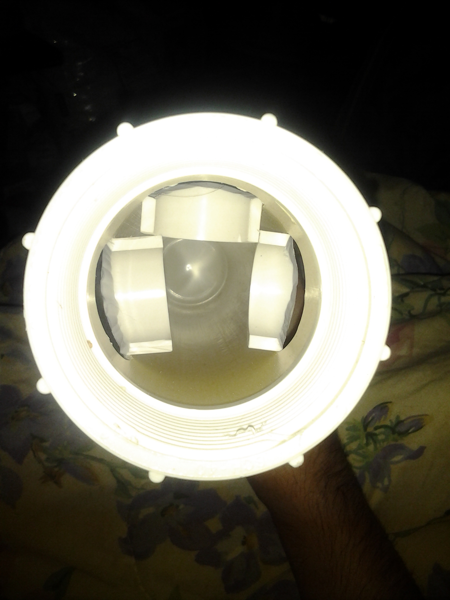 View of the underside of the feeder with and drain cap opened. I made the openings lower and the ports shallower.  Works much better than the old version.