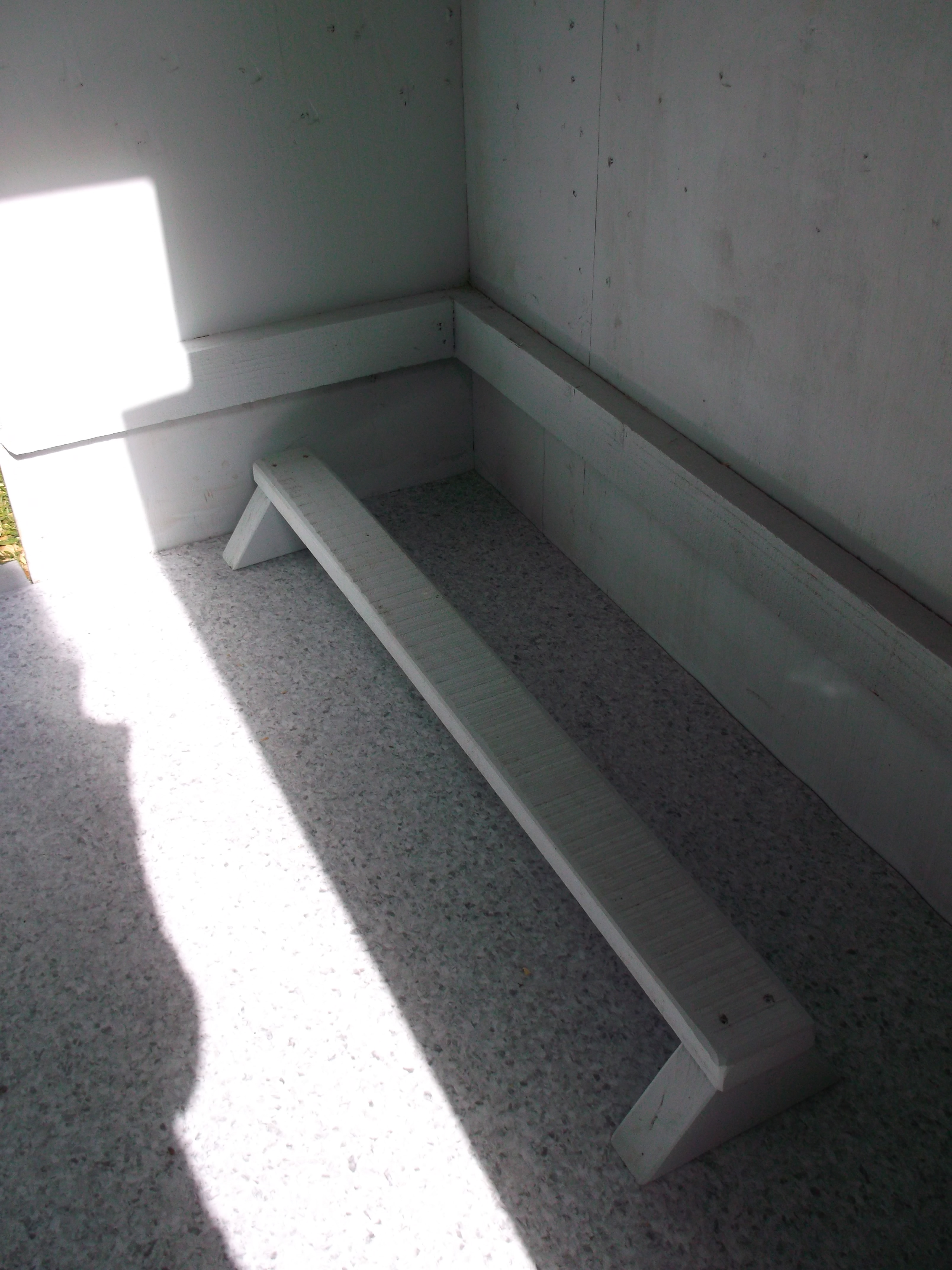 Vinyl flooring down.Roost bar will be placed on top of a poop tray.