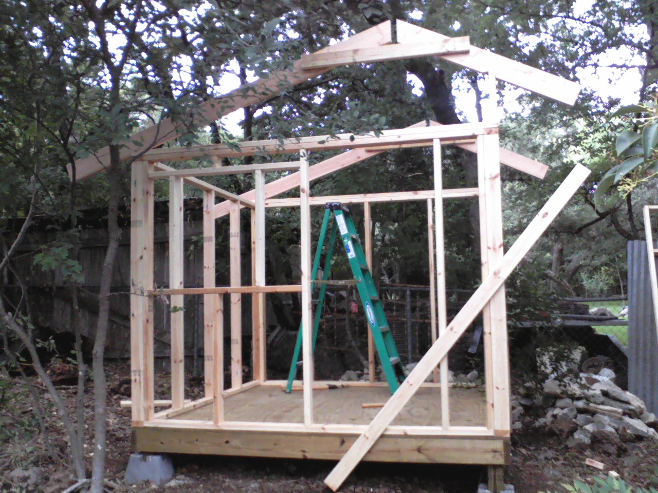 Walls and rafters going up.