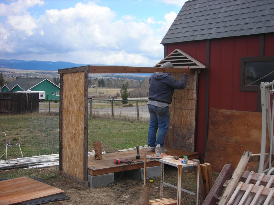 We began in May with materials we had or had found in the free section of Craigslist.  We do have a local place in Missoula called Home Resource - people take materials from deconstruction, etc. and you can get great deals - and we did get a few things there.  I think we bought some 2x4s and the roof vents there, we got plywood from somebody doing deconstruction and the rest was free.  I would say we spent less than $200 on all the materials, including the chicken wire for the run.
