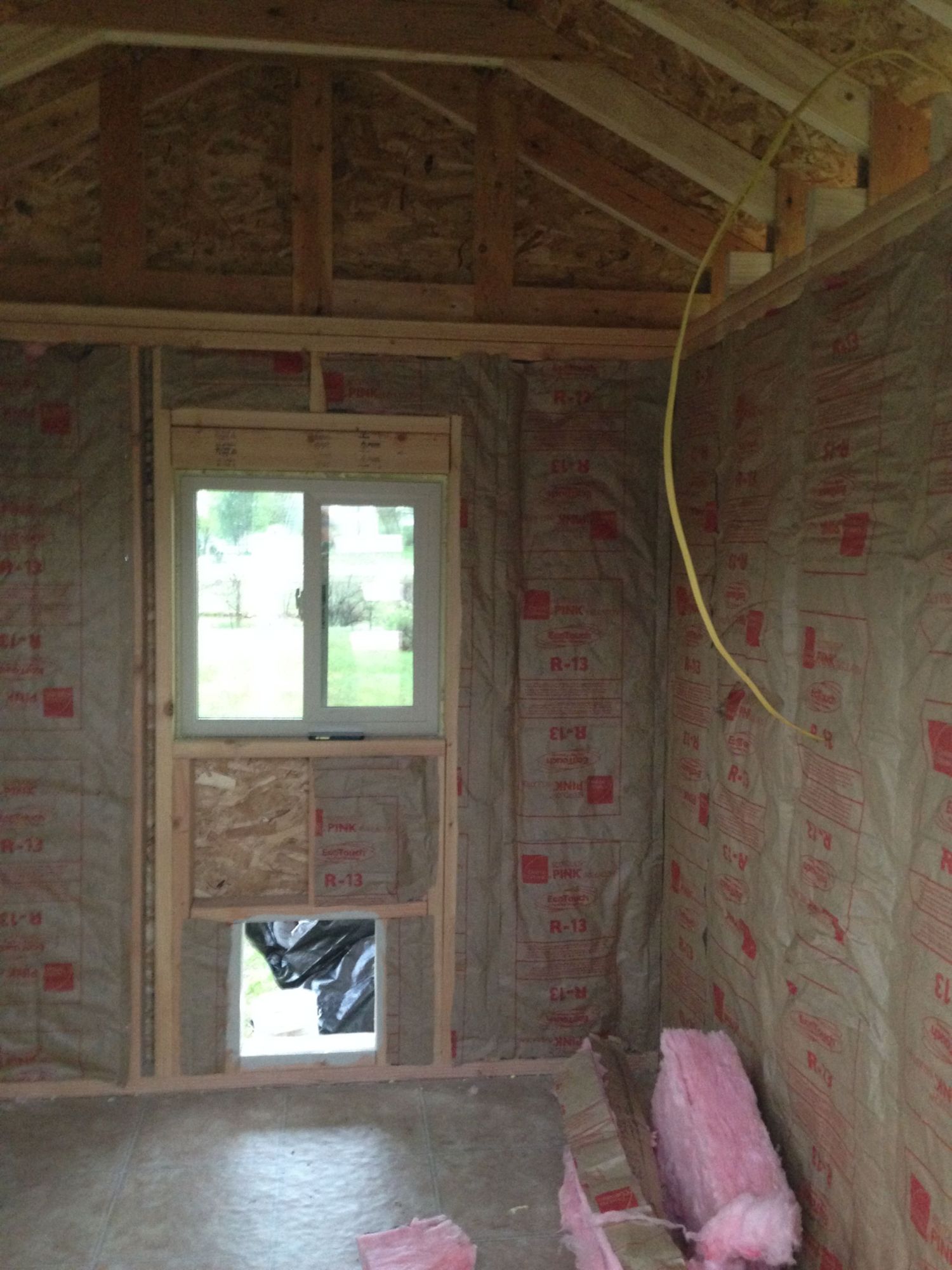 We chose to insulate, not as much to keep warm in the winter, but to keep cool in the summer.  So far, I am SO glad we did this.  It has been ridiculously hot the past few weeks, and the coop is wonderfully ventilated and stays at a very nice temp.  You can also see, we are adding electrical wiring for later use.  We are going to eventually add a solar panel- just for light, and maybe a method of heating their waterer (I have read about using a light bulb inside a cinder block and setting water container on top- but that is something for us to learn this winter!).