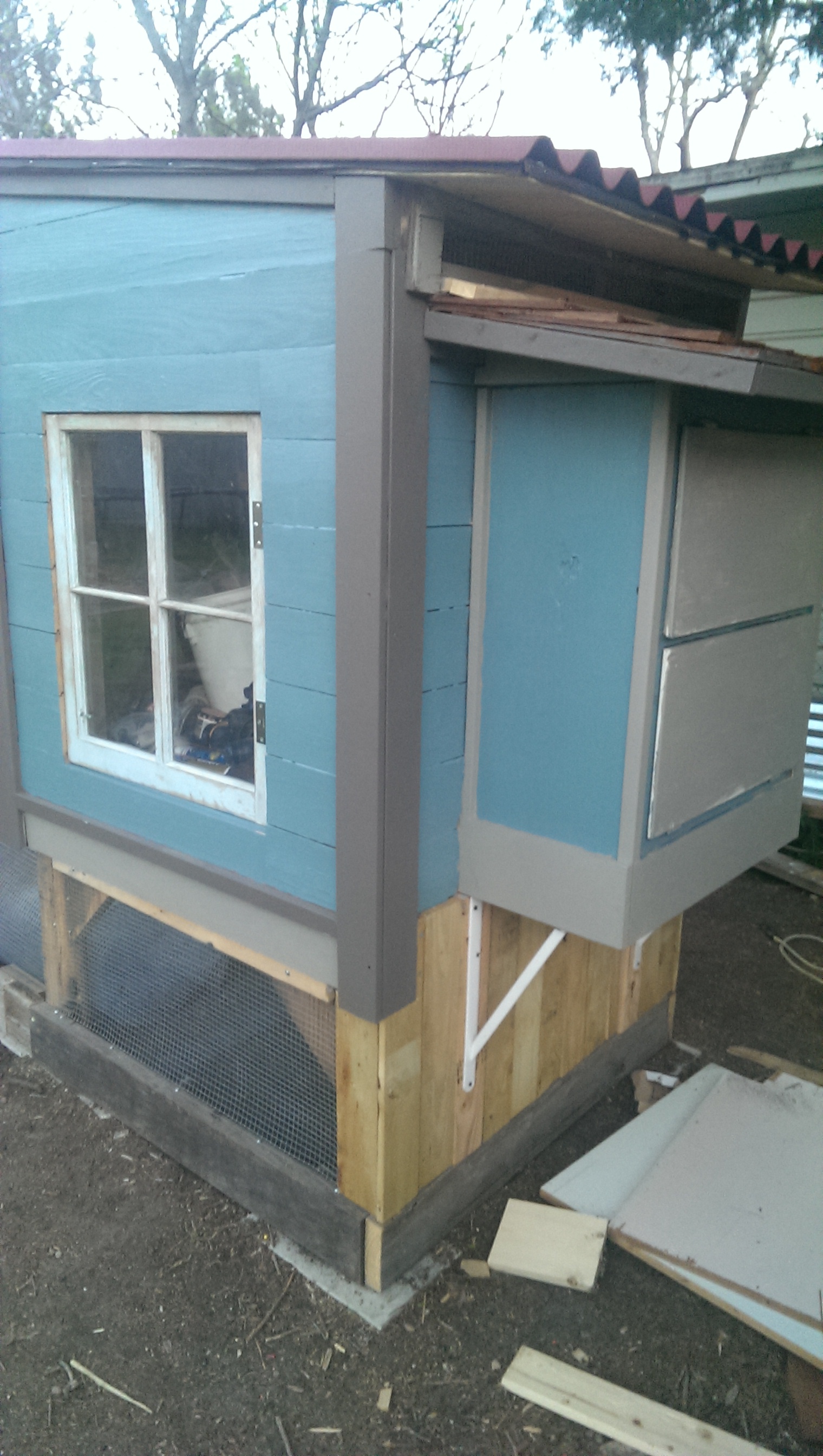 We decided to put siding around two sides of the bottom of the coop, the chickens will have access under there and we decided a little wind break and sheltered area would not be amiss.