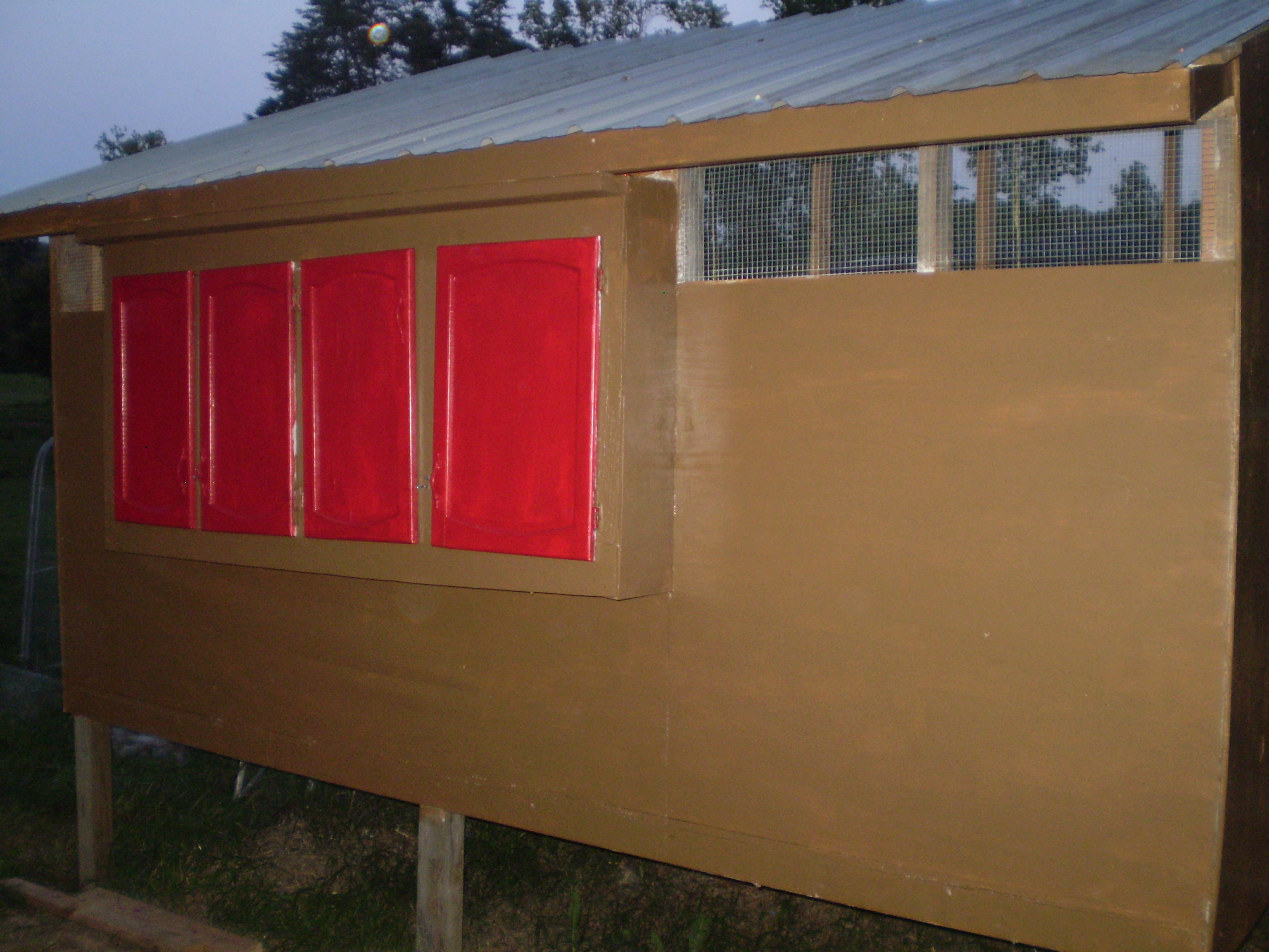 We have exterior access to the nest boxes thru these recycled cabinet doors.