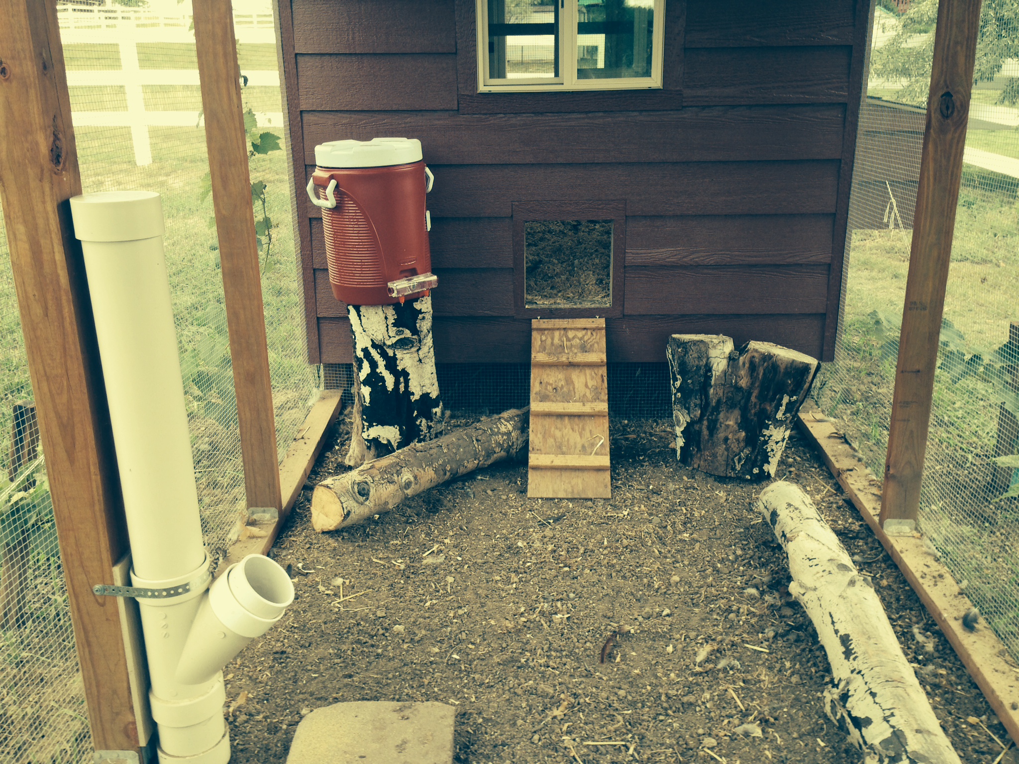 We have since added PVC feeders and BriteTap nipple waterers in both the run and coop.  This was possibly the best thing we ever did.  SO MUCH EASIER AND CLEANER!