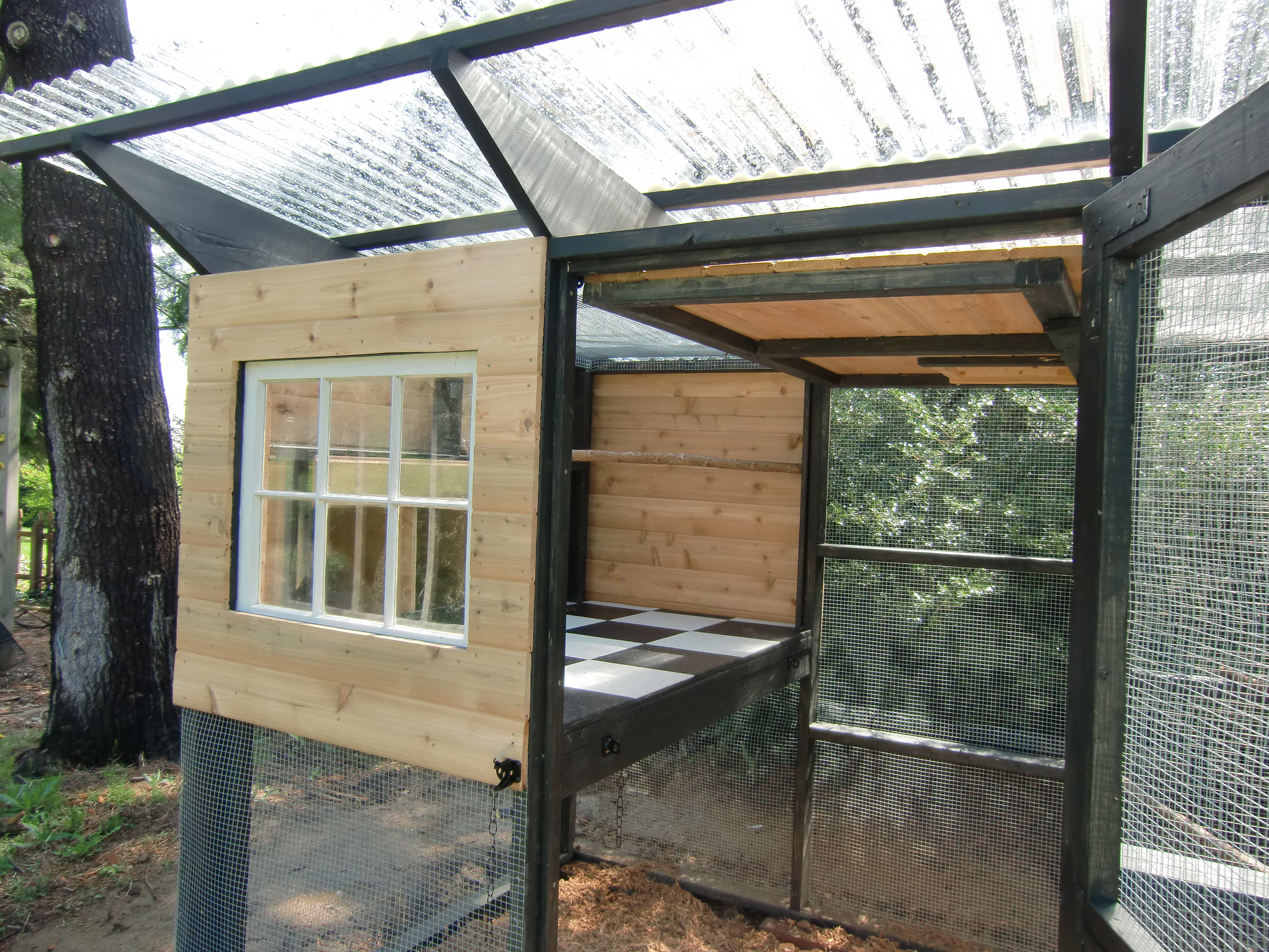 We hinged the entire side of the hen house so it can be flipped up for cleaning (it is held in place be two pieces of wood on top that swivel). One of our better decisions as it has worked wonderfully.
