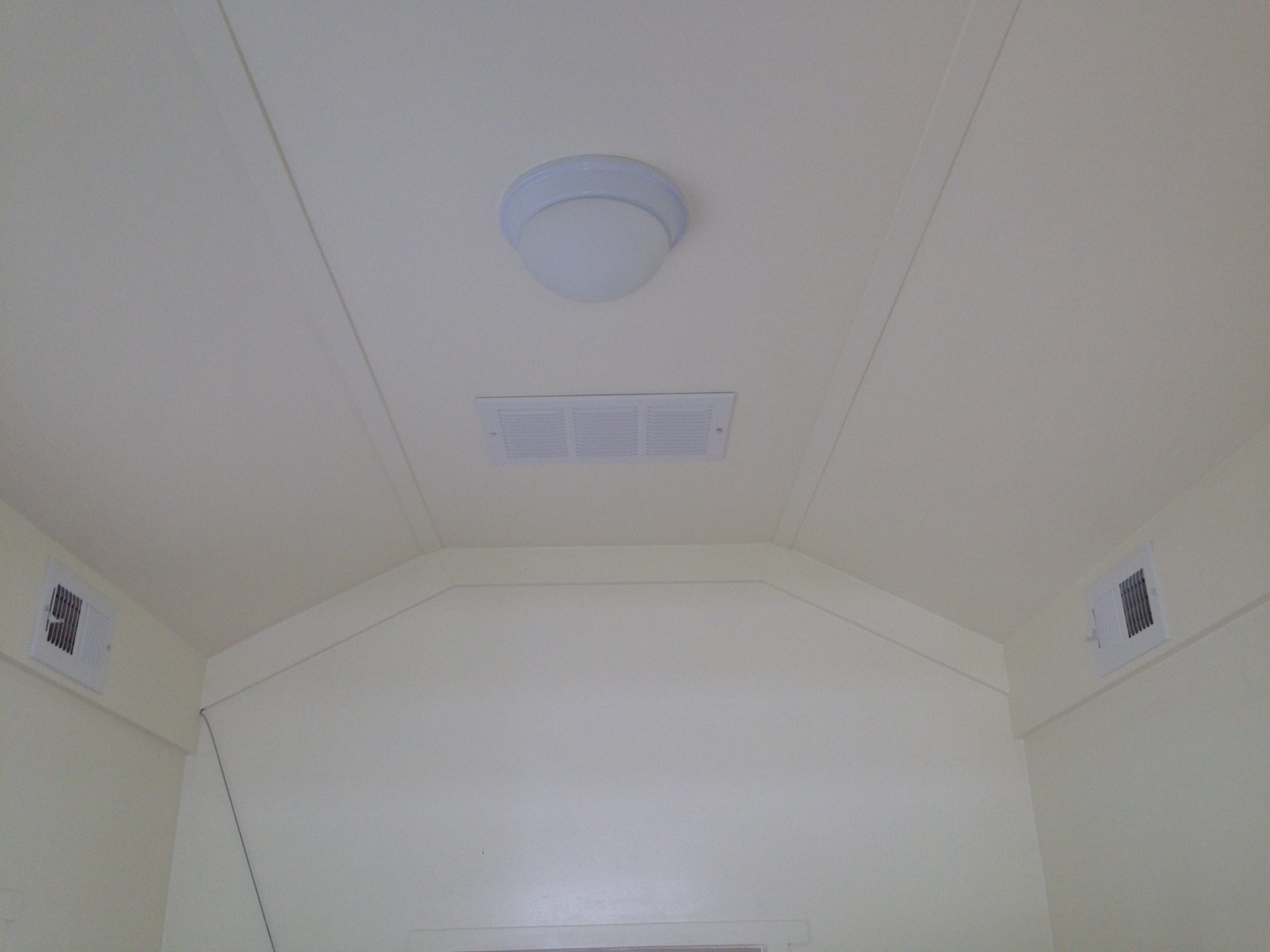 We put a ridge vent in roof and then vents along the side to help with circulation.  Right now, we keep the windows open because it's so hot this summer.  Guess we'll have to wait for winter to really see how our upper ventilation works out.  The light of course, is not functional right now, as we do not have our solar panel set up yet.