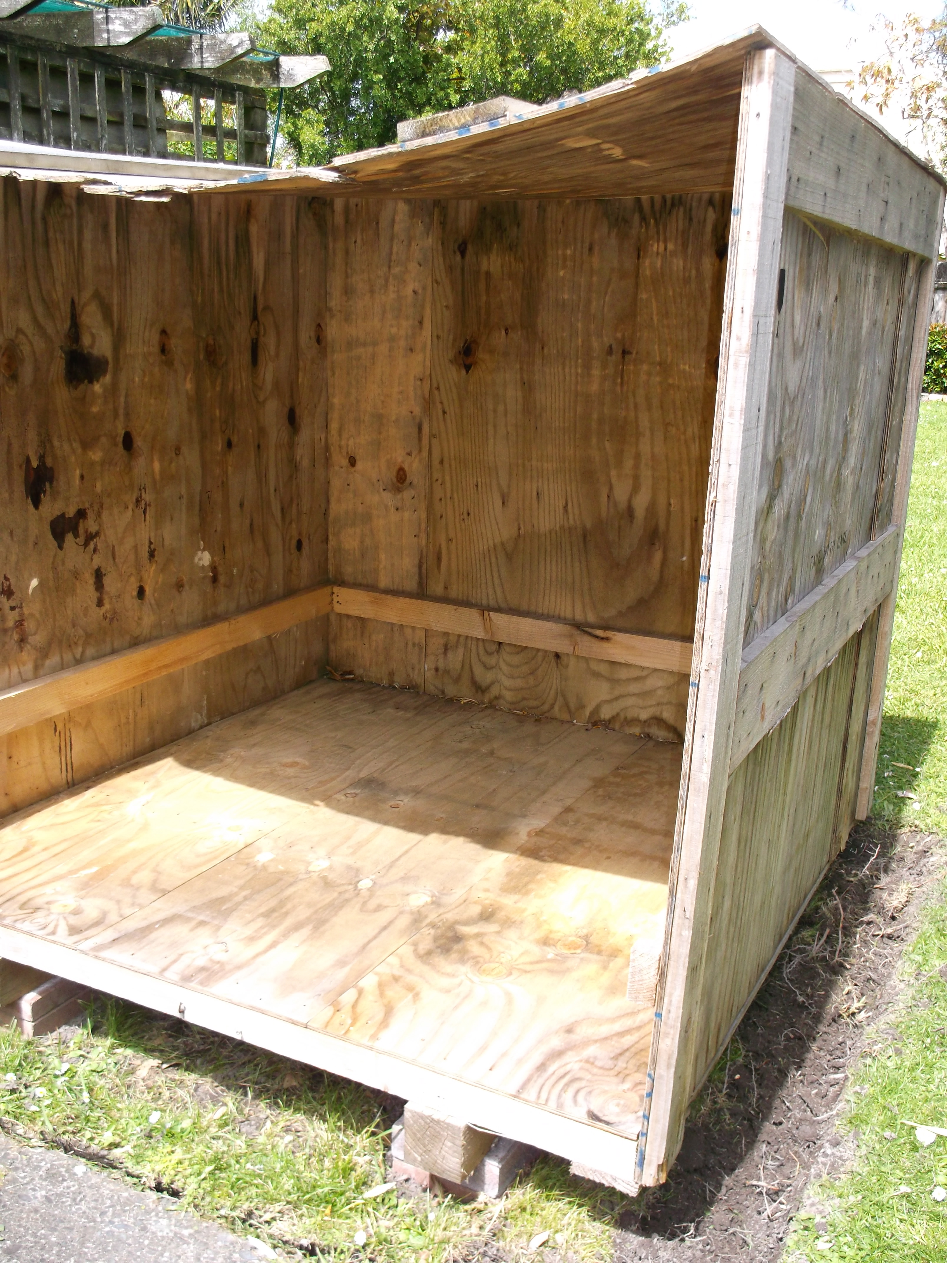 We started with a shipping crate. Free! Here it is leveled and sitting on paving stones.
