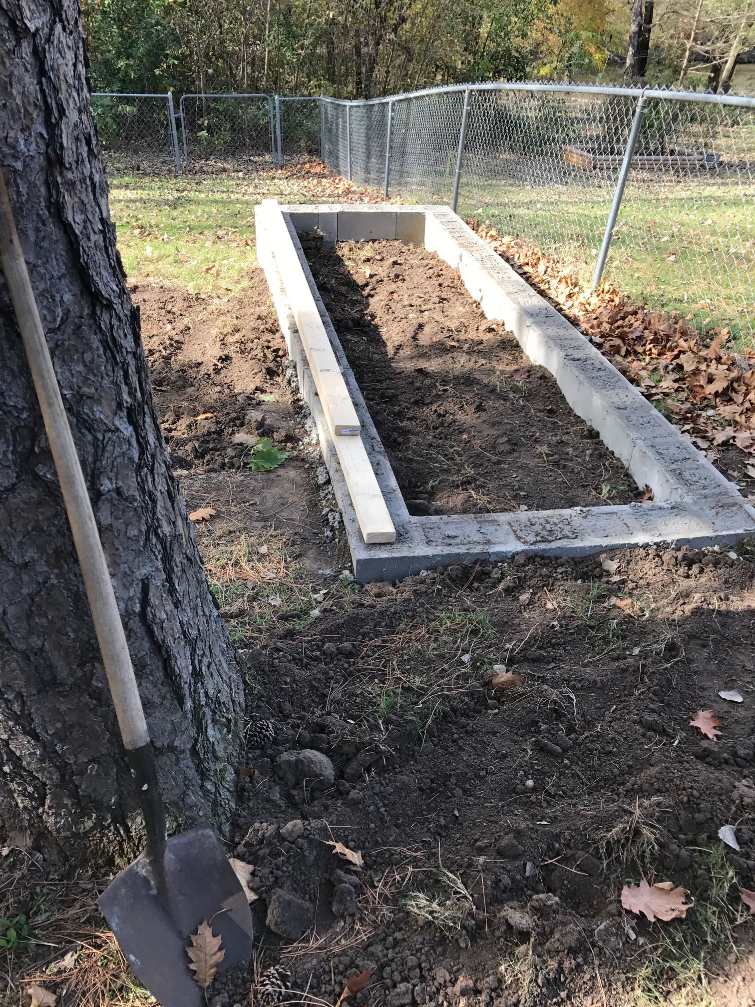 We used cinder blocks for the foundation.  Because of the slope of our yard we had to stack them two deep.  Then we filled the holes with concrete.