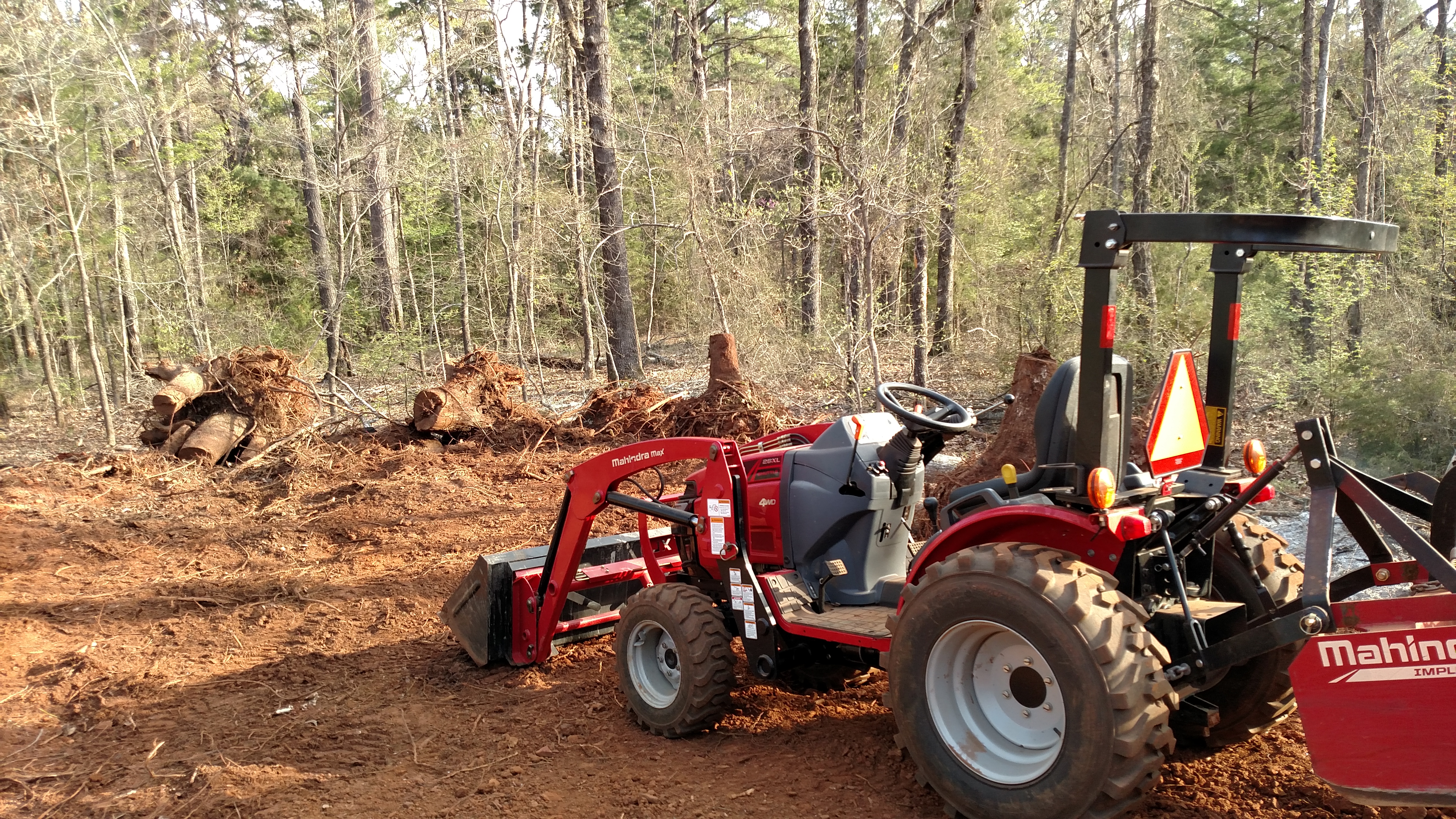 Weekend warrior at my brother's future homestead.  More stump moving, leveling, log moving, equipment hauling...