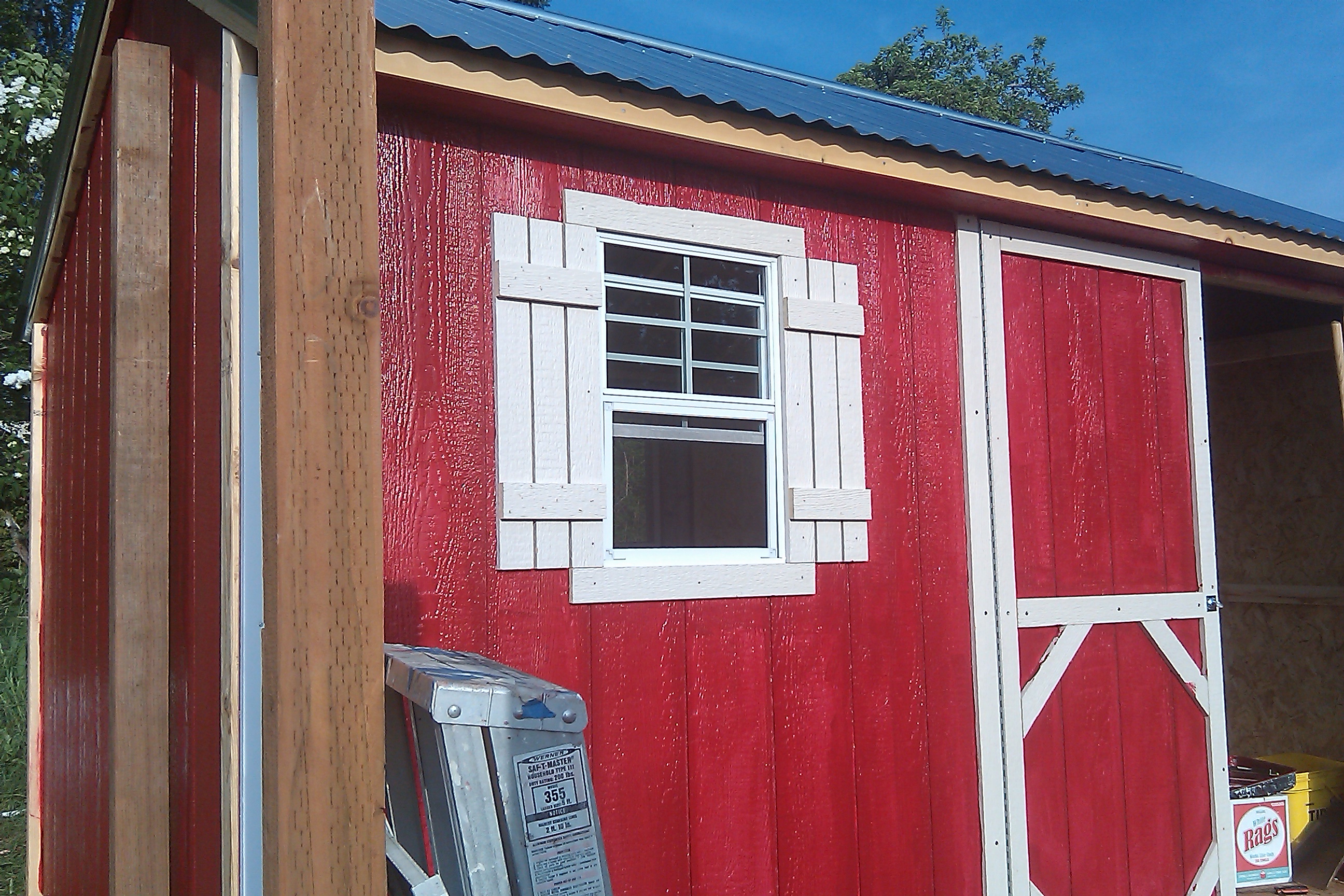 West window before the porch addition.  Note clearance between man door and roof, not much room for a gutter.