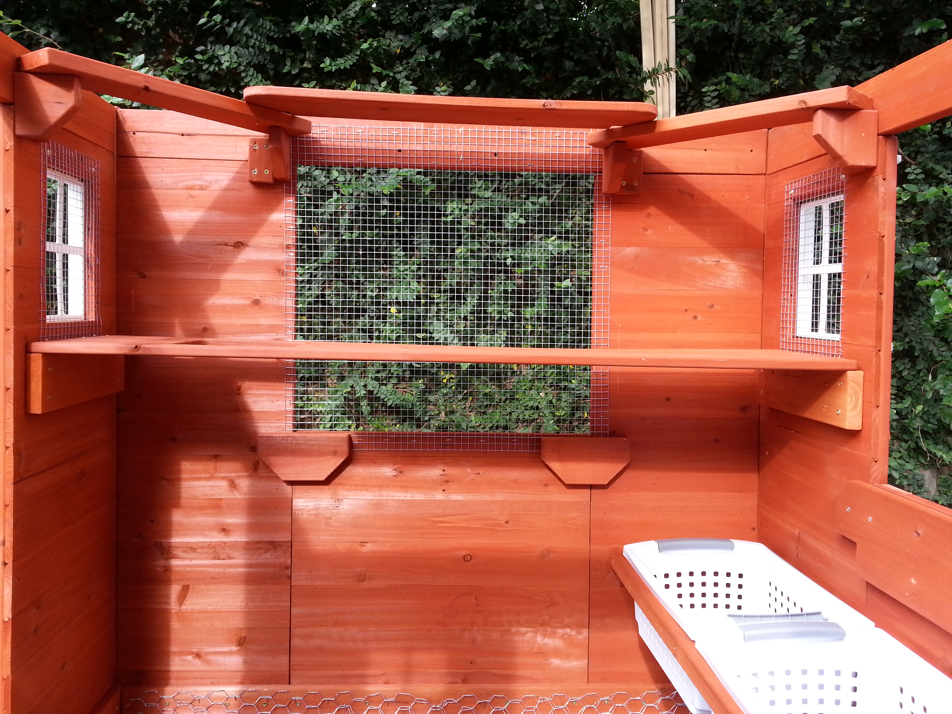 We've given the girls two levels on which to roost. Hope they'll be comfy. Still trying to figure out what to do about a "poop slab" beneath the roost. Suggestions?