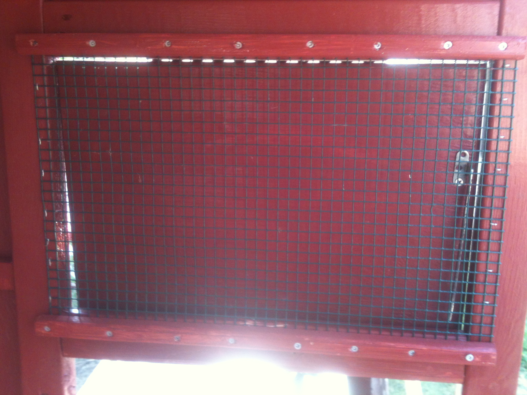Window easy to do. Staple wire and add a screwed in trim so it can't be pulled out.