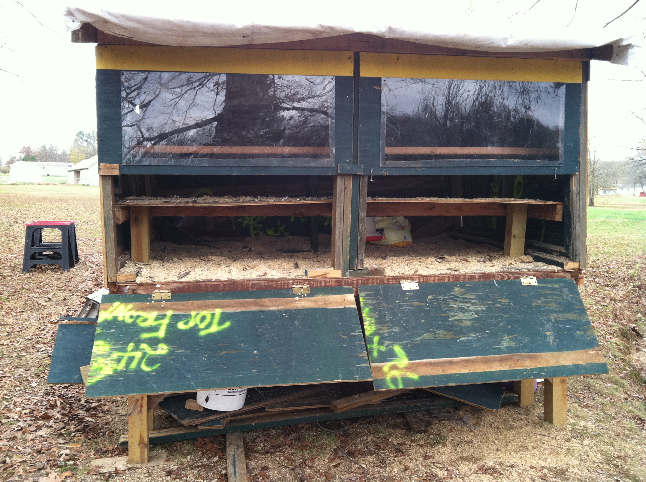 With the doors down, cleaning the poop board is super easy! A 5 gallon bucket fits under the edge and just scrape off the poop with a hoe or trowel. A wheelbarrow will go under the edge of the drop down doors for easy removal of the shavings.