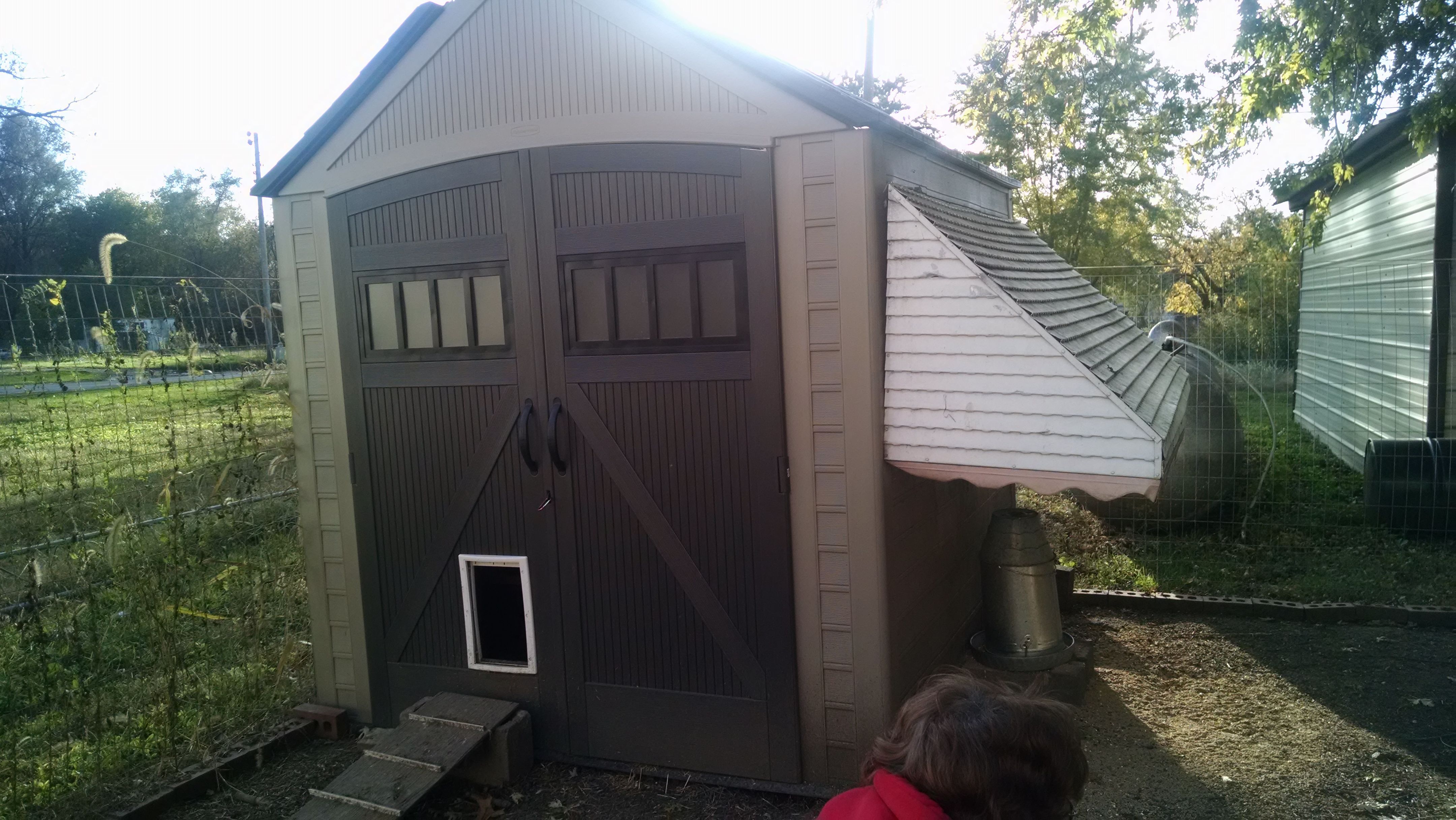 yes this is a rubbermaid shed with a doggie door.