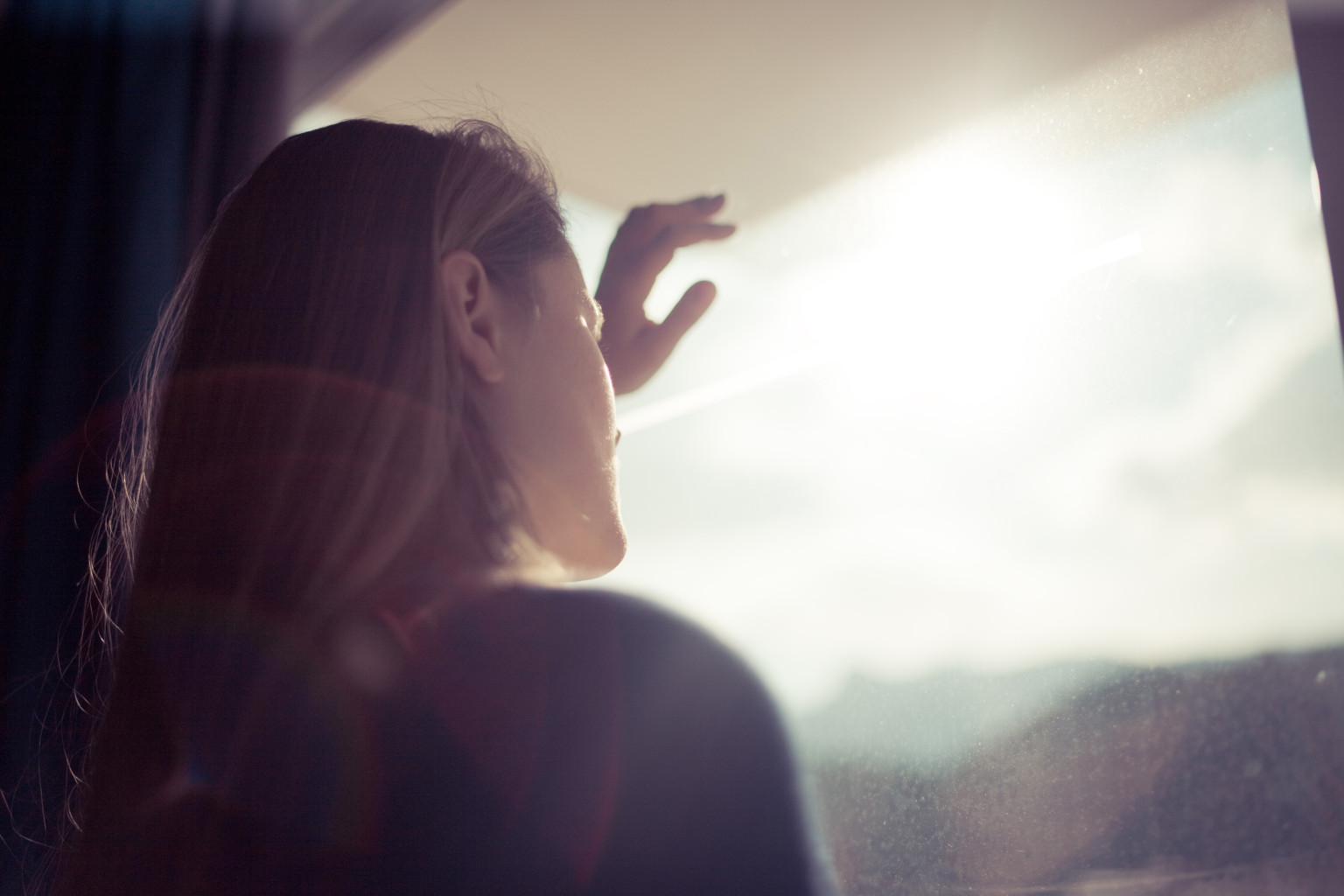 o-woman-looking-out-window-facebook.jpg